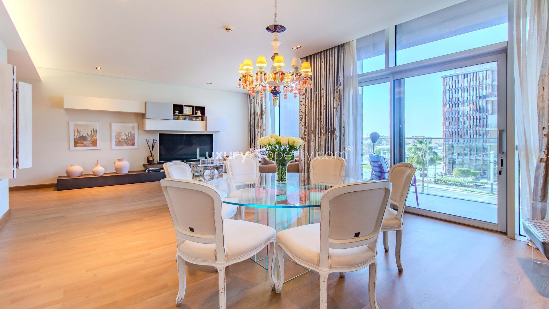 Elegant dining area with chandelier in City Walk apartment, Building 16, Boulevard view