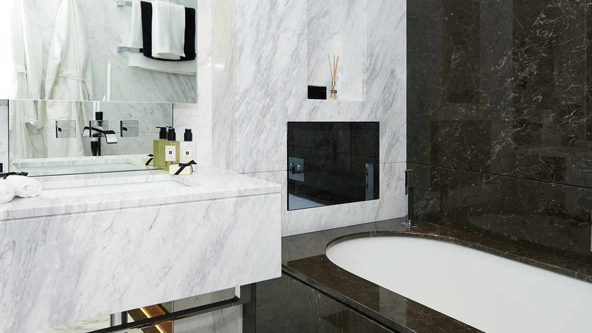 Luxurious bedroom in Sovereign Court apartment, Hammersmith, featuring elegant decor and modern furnishings