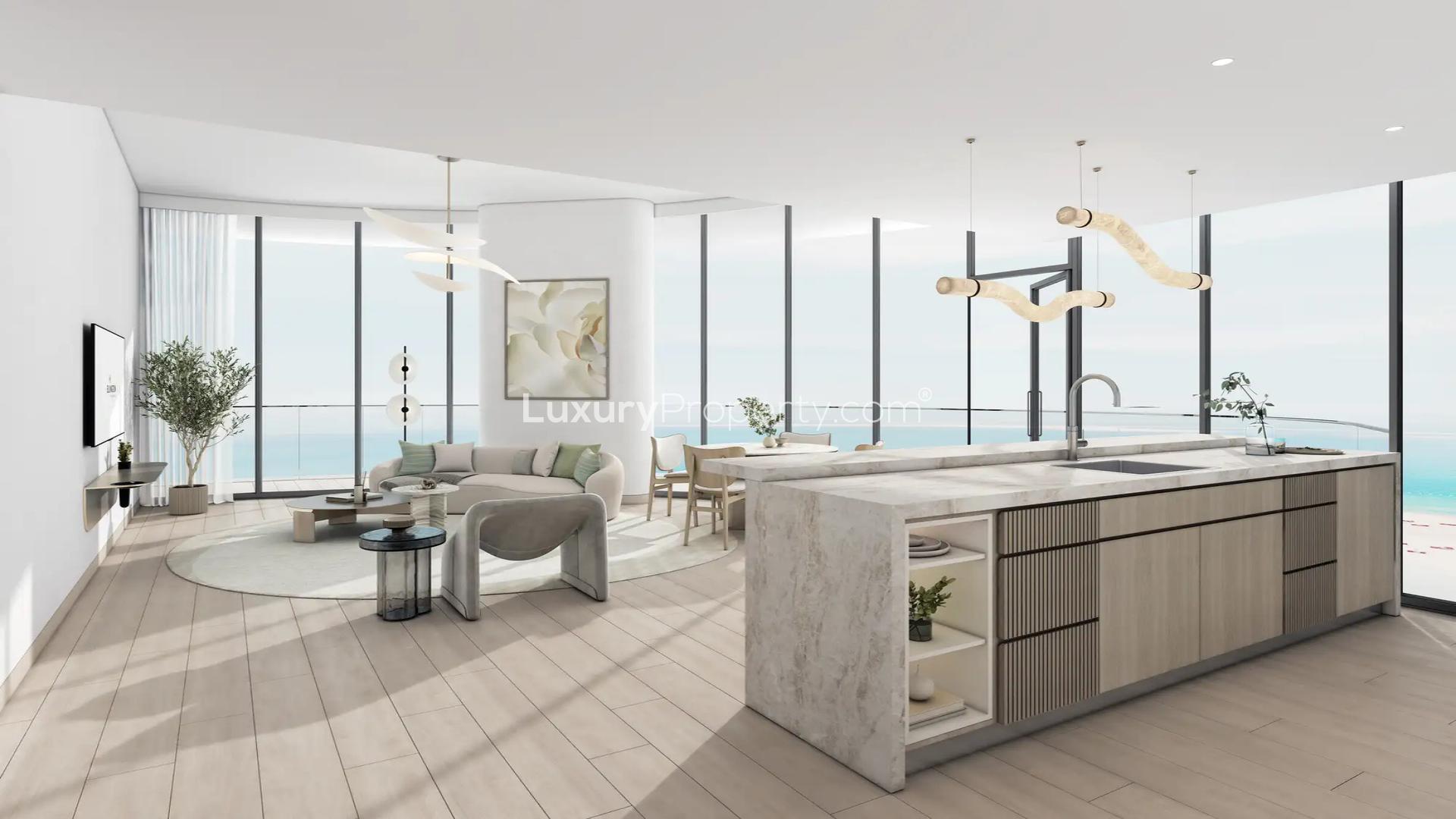 Balcony view of Ellington Views II apartment overlooking pool and palm trees in Al Hamra Village