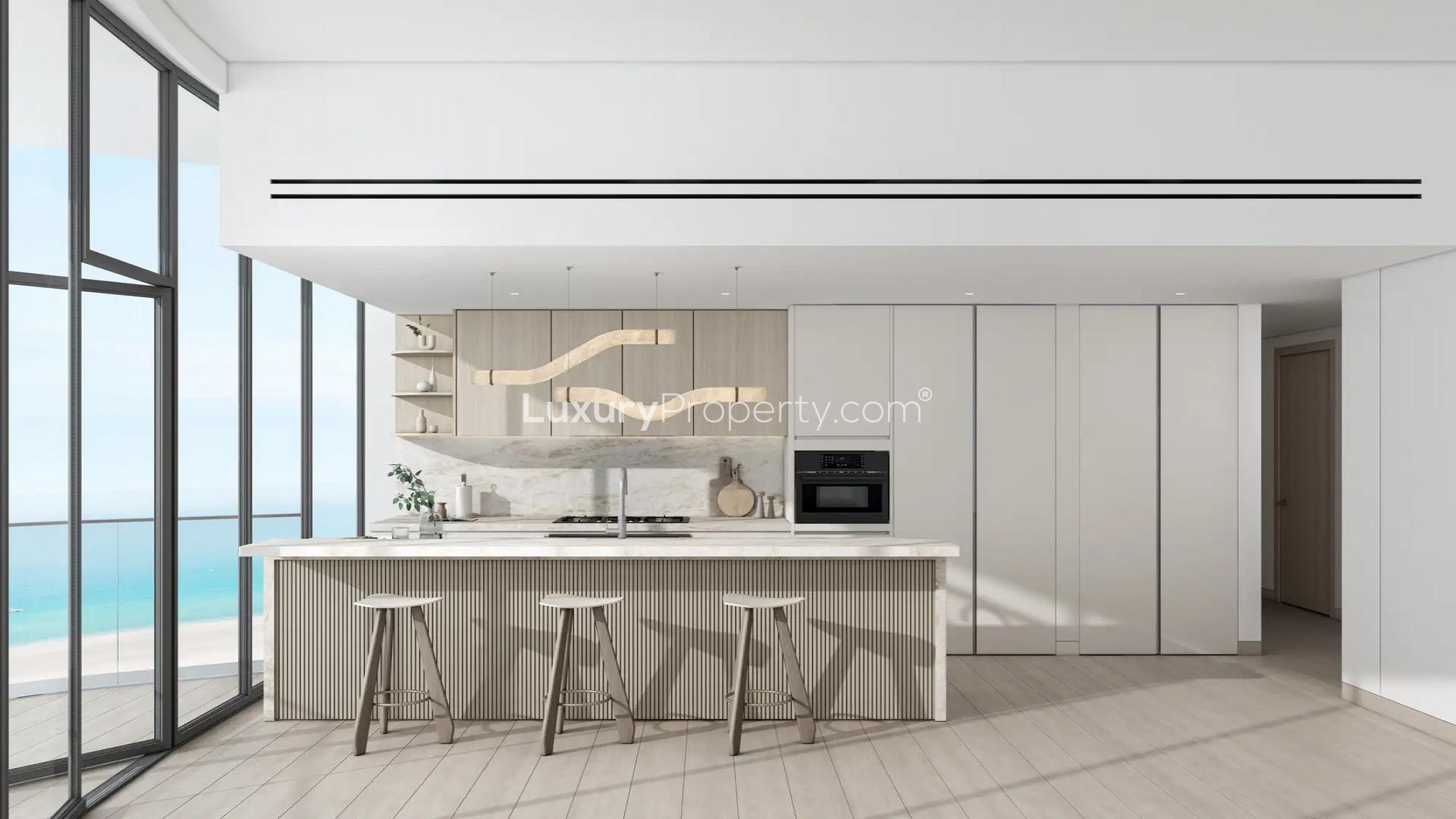 Modern living room in Ellington Views 2 apartment, Al Hamra Village, with sea view balcony