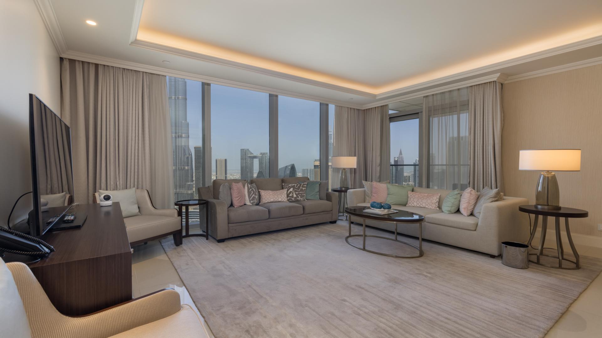 Balcony view from luxury apartment in Downtown Dubai, overlooking city skyline and skyscrapers