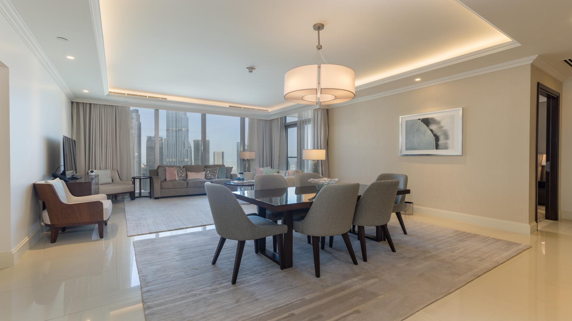 Fully furnished living room with Burj Khalifa view in Downtown Dubai apartment for sale