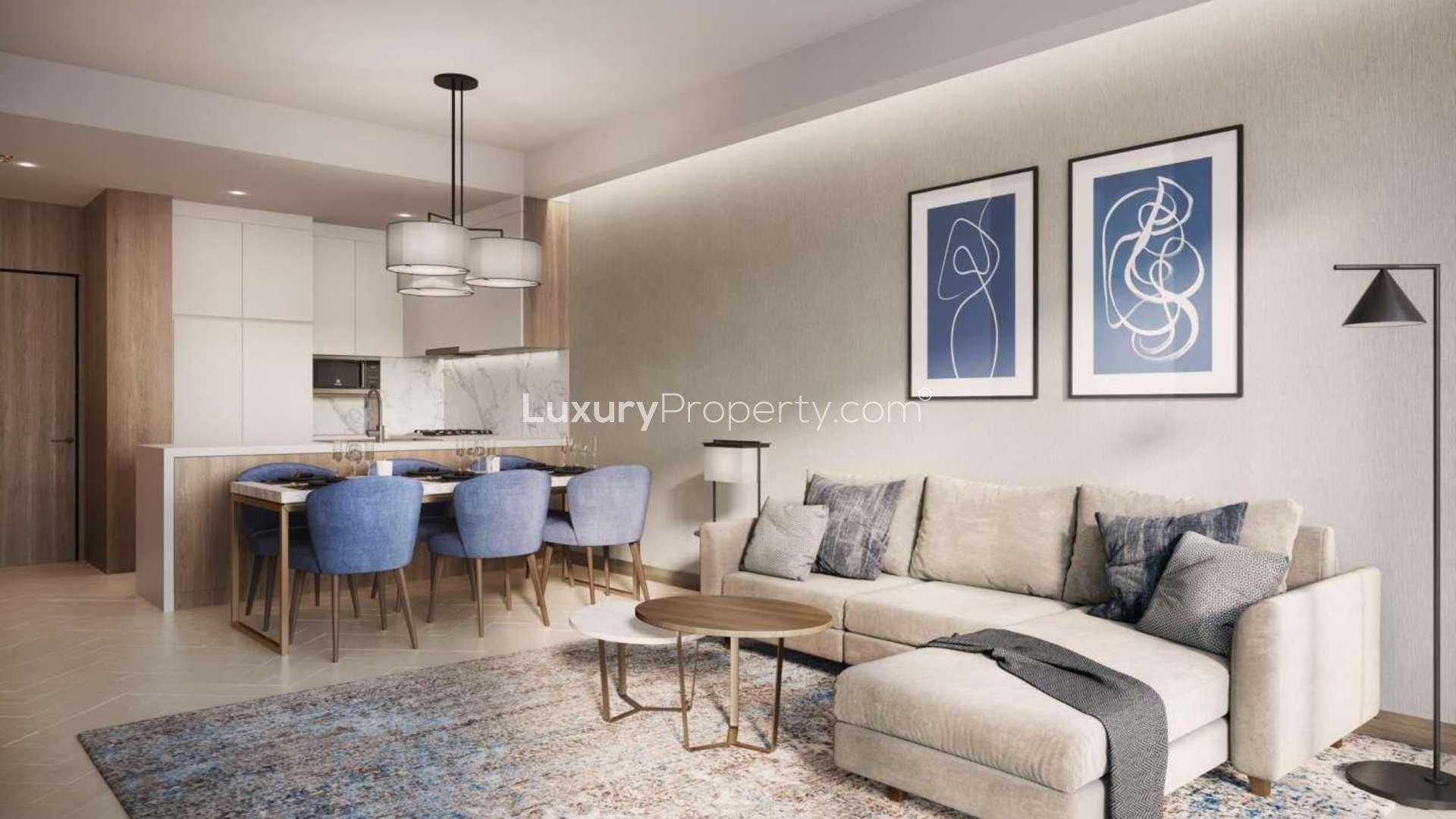 "Elegant Downtown Dubai apartment dining room with Burj Khalifa views through large windows.",Modern living room in Downtown Dubai apartment with elegant decor and blue dining chairs