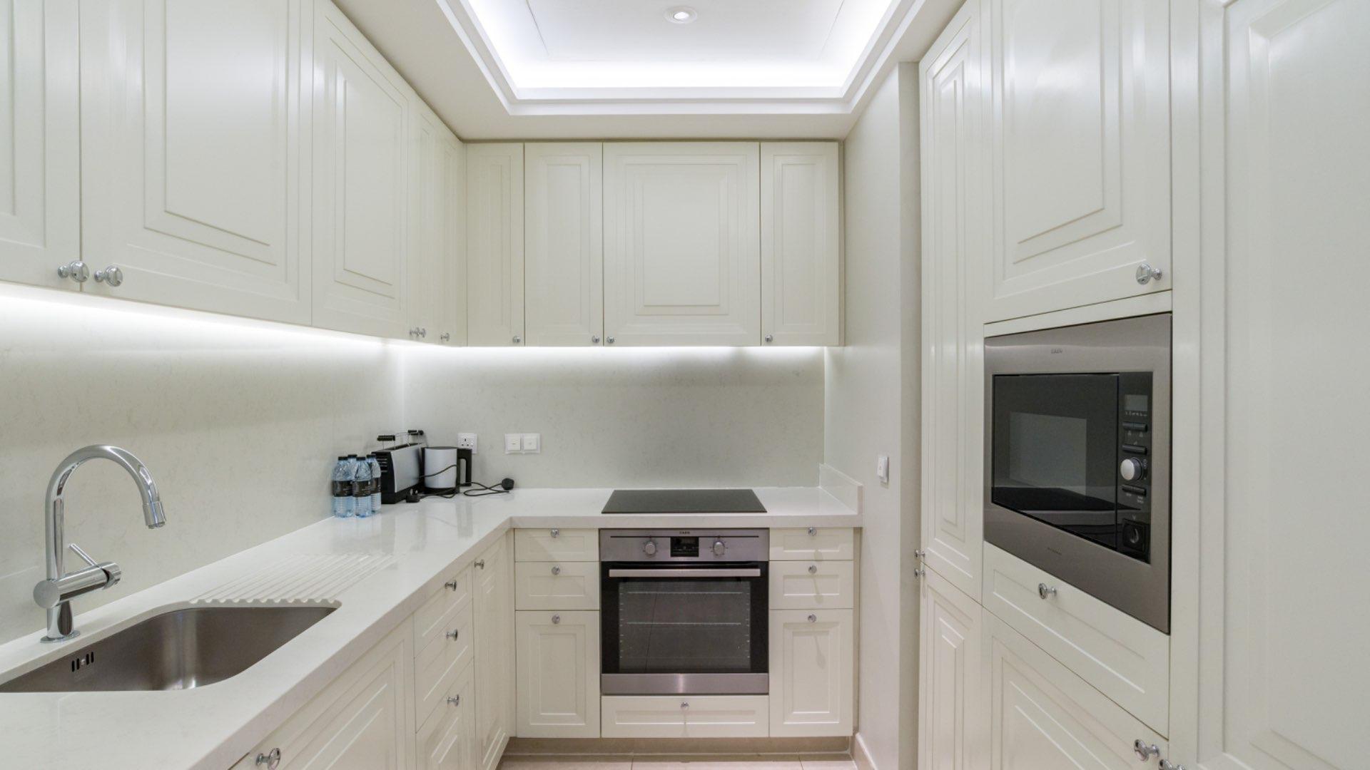 Luxurious living room in 3-bedroom apartment, The Address The BLVD, Downtown Dubai skyline view