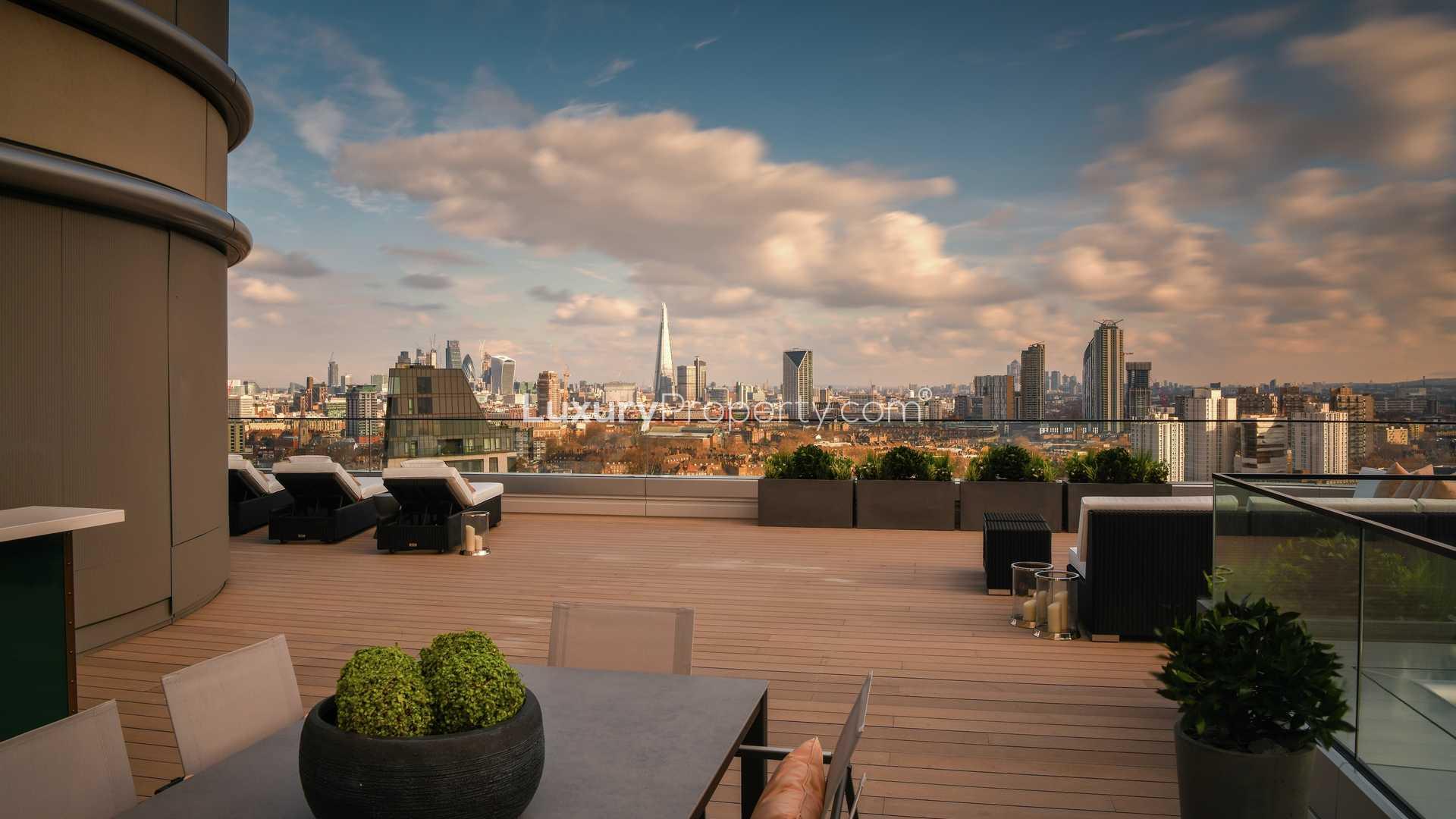 "Rooftop terrace view from The Corniche apartment, South Bank, London skyline in background.","Stunning terrace view from three-bedroom apartment at The Corniche, South Bank, London.",Luxury bedroom in The Corniche apartment, London, with stunning river views