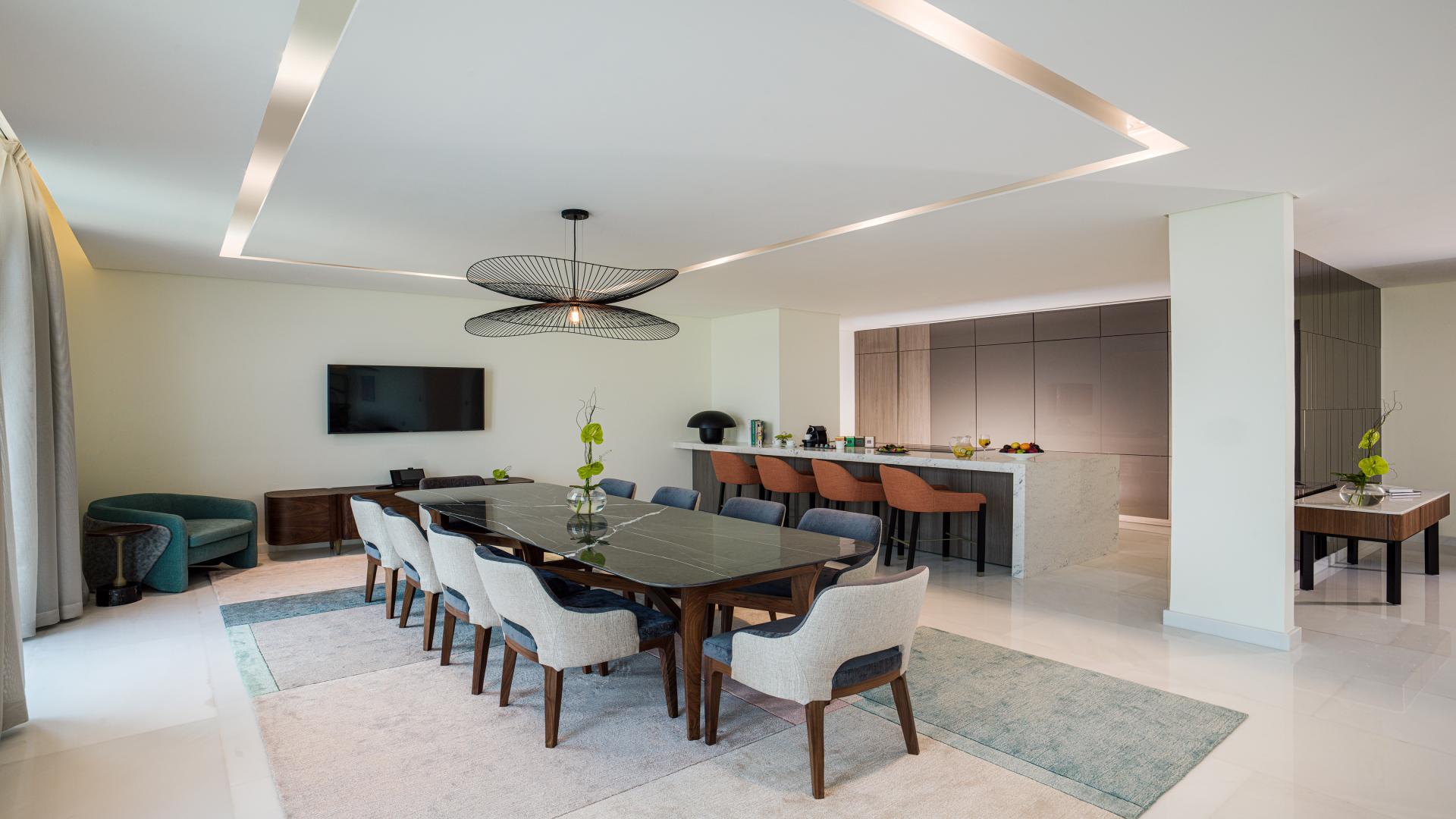 Aerial view of luxury beachfront apartment complex, Palm Jumeirah, with private beach access