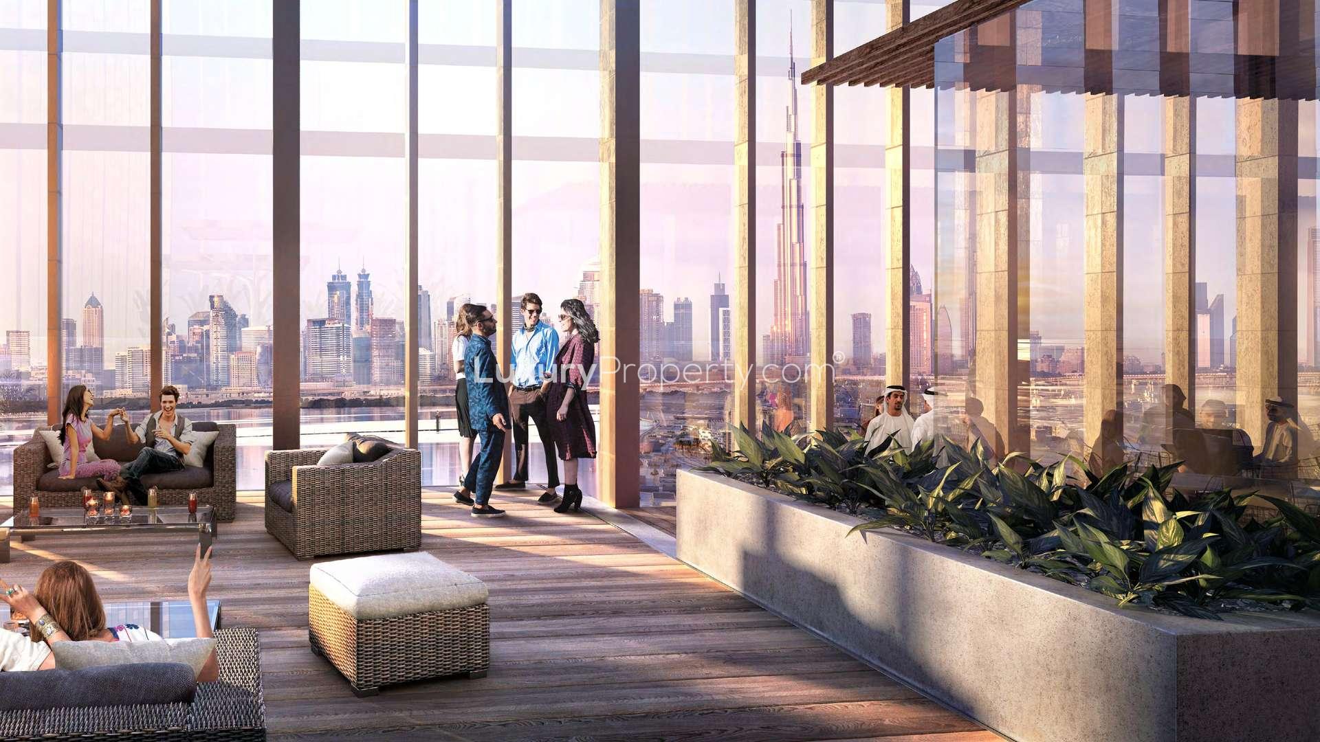 Luxurious living room with city skyline view at The Grand, Dubai Creek Harbour