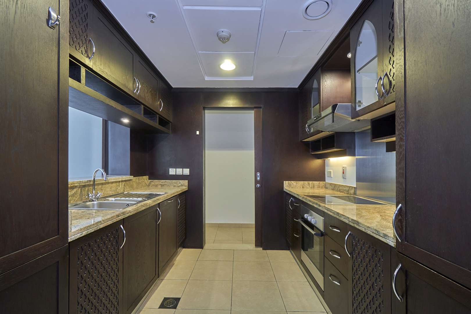 Empty room with large windows and city view in Downtown Dubai apartment