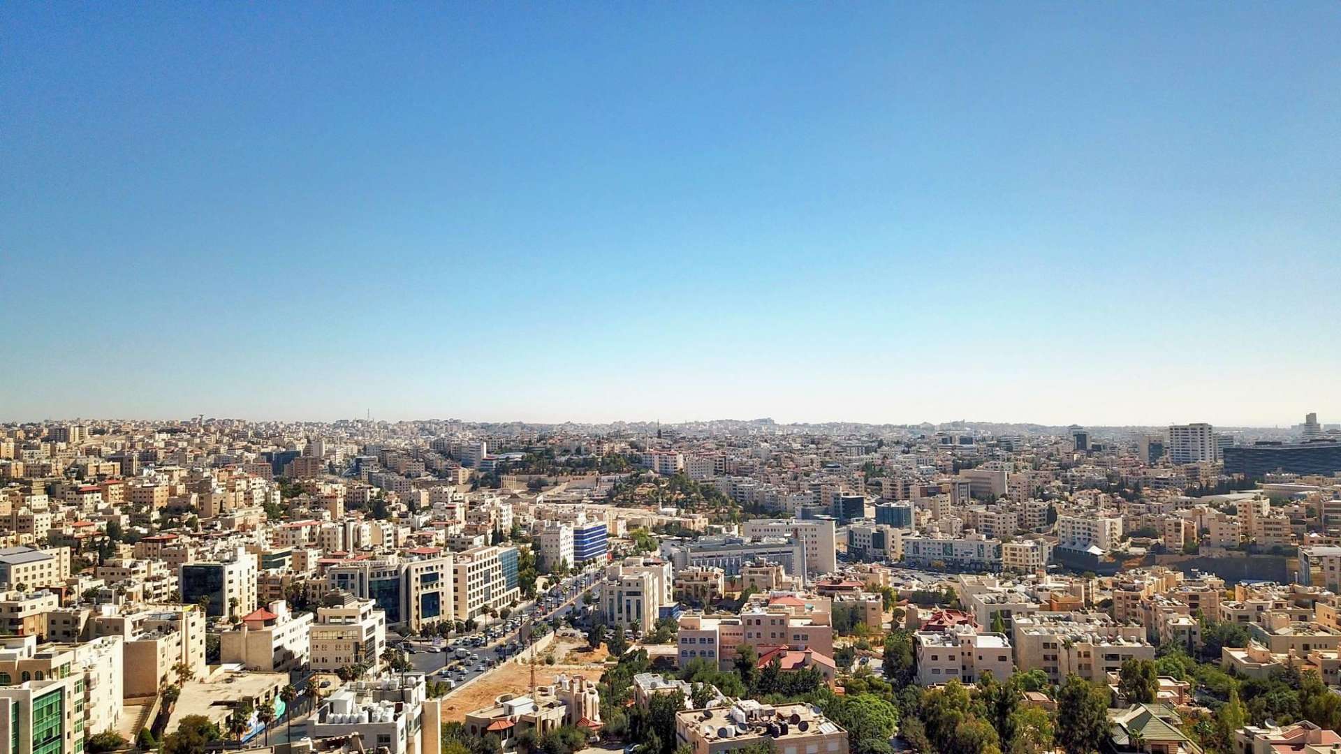 Skyline view from The Ritz-Carlton Residences, Amman, showcasing cityscape and luxury living environment.