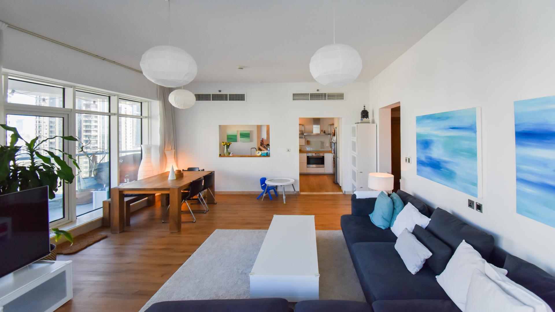 "Trident Bayside apartment balcony with stunning Dubai Marina skyline and water views.",Upgraded 3-bedroom apartment interior with marina view, Dubai Marina, Trident Bayside