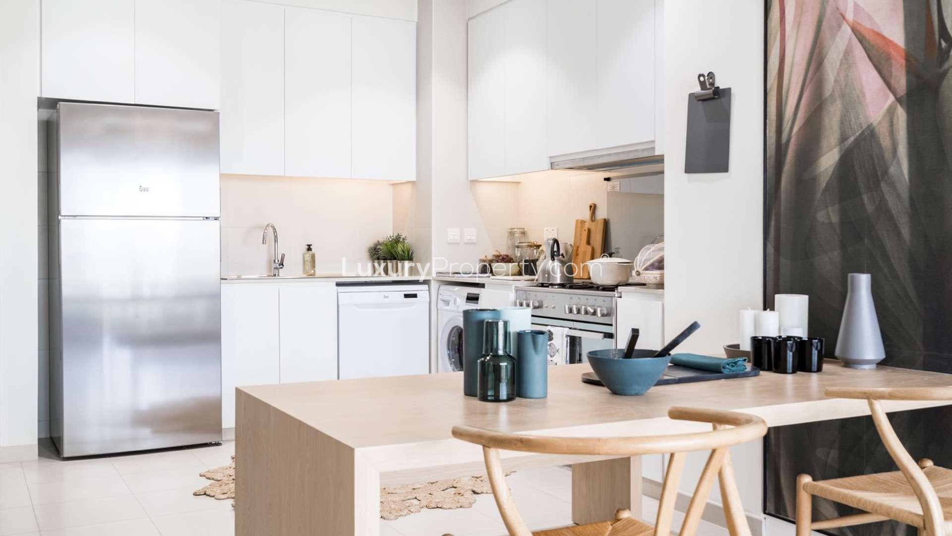 Modern kitchen and dining area in 3-bedroom townhouse, Urbana, Emaar South