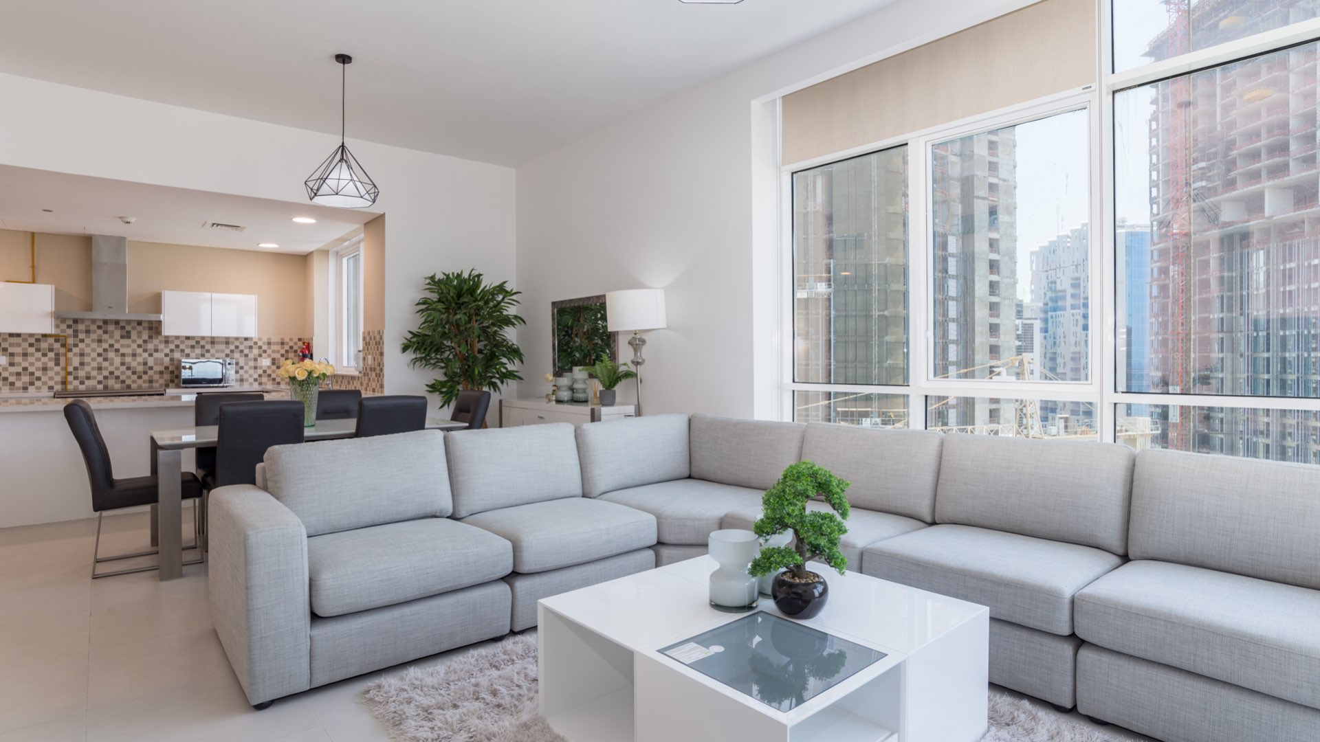 Modern living room in Vezul Residence apartment, Business Bay, with city view and stylish decor