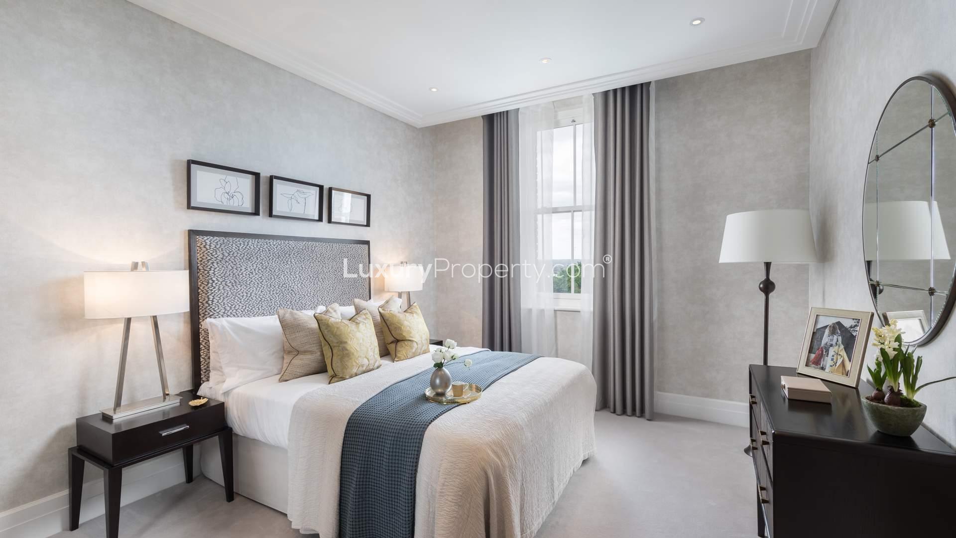 Luxurious bedroom in three-bedroom triplex apartment, Wimbledon Hill, London, featuring elegant decor