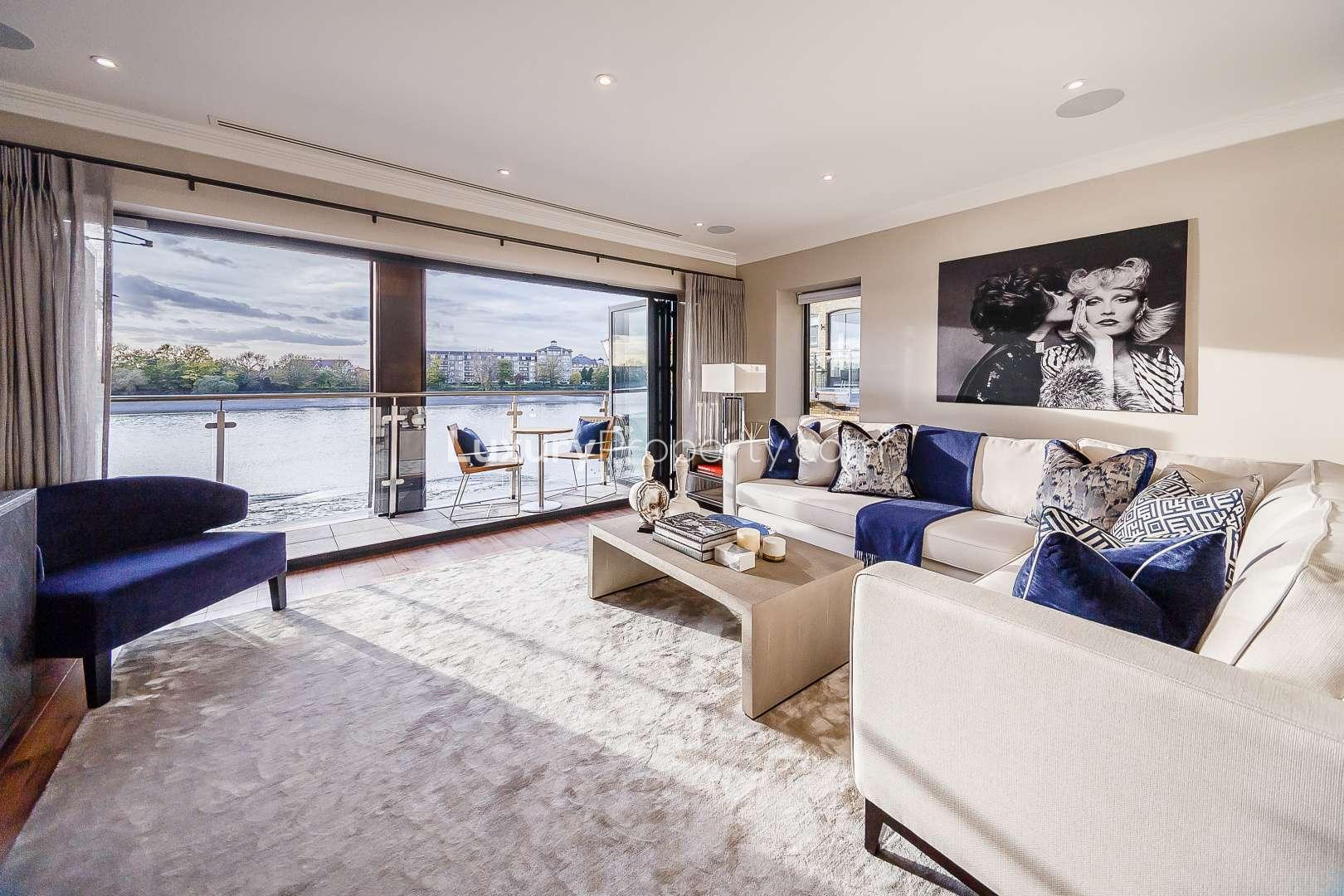 Modern living room with river view at 3 Oxbridge Terrace, Palace Wharf, London apartment
