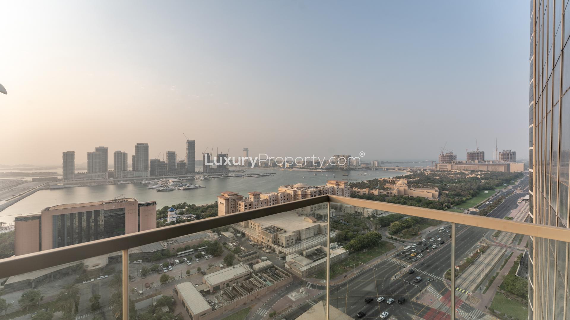 Modern living room in 3-bed apartment, Ocean Heights, Dubai Marina, with city skyline view
