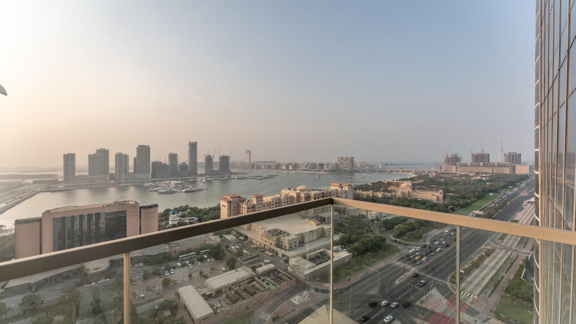 Modern living room in 3-bed apartment, Ocean Heights, Dubai Marina, with city skyline view