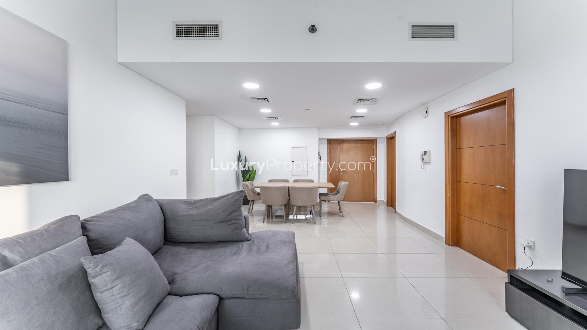 Modern living room and dining area in 3-bed apartment, Ocean Heights, Dubai Marina