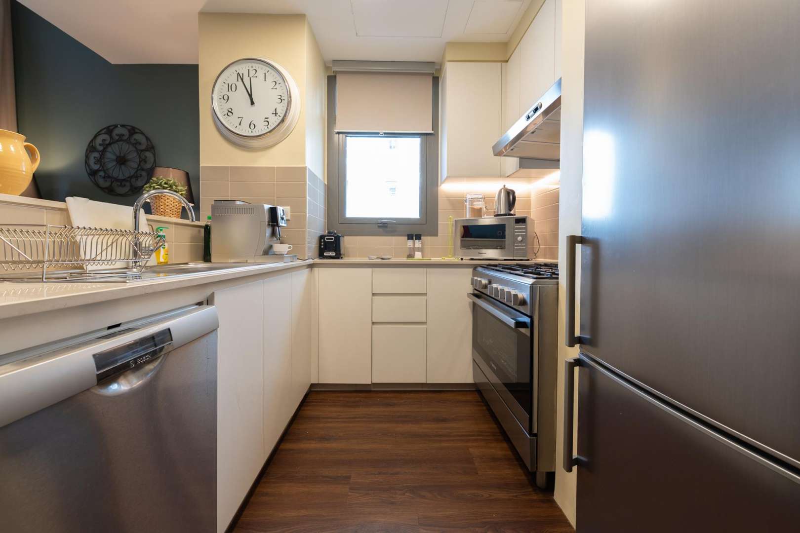 Cozy living room in Zahra Apartments, Town Square, with modern decor and ample seating