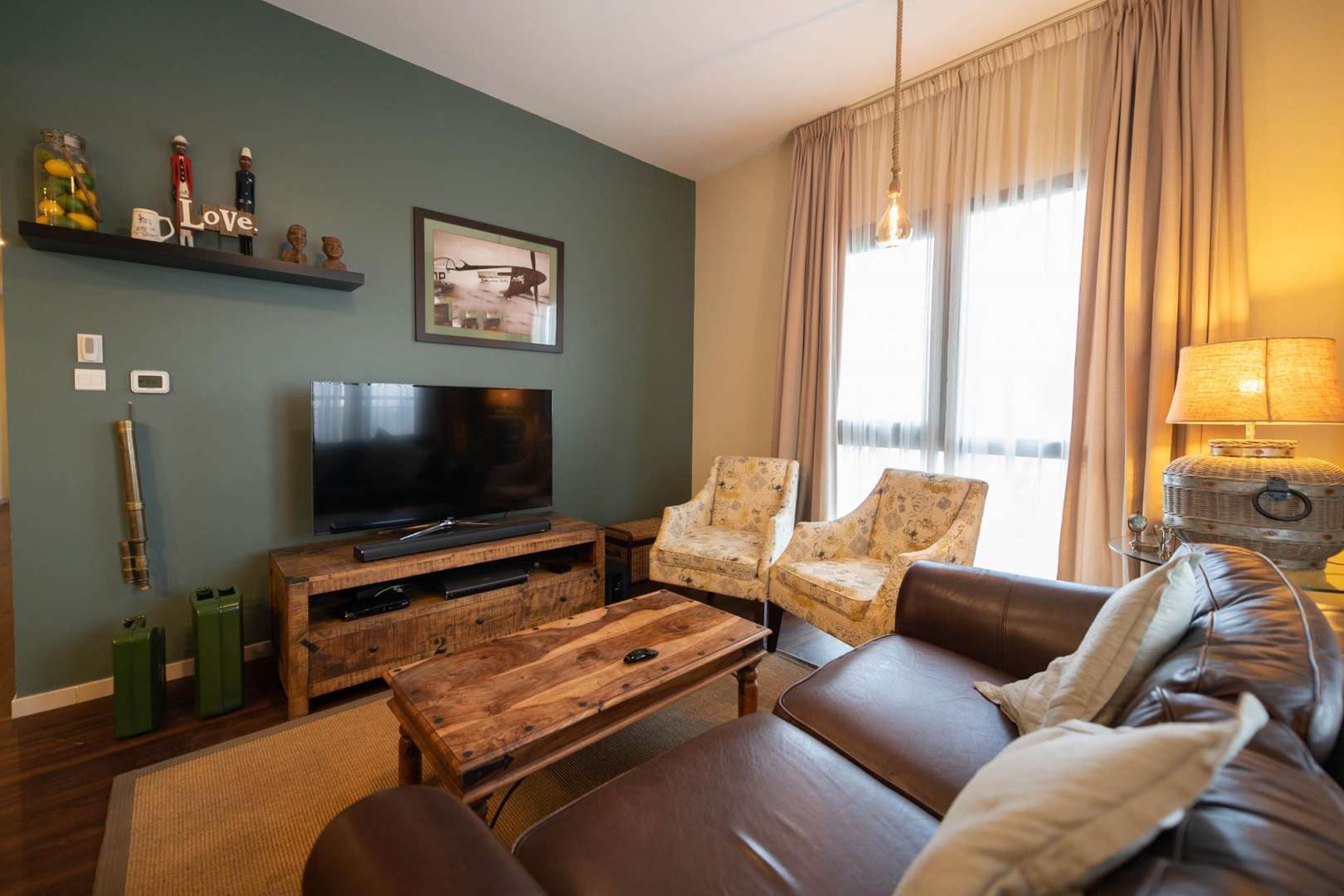 Cozy living room in 3-bedroom Zahra apartment, Town Square, with elegant furnishings