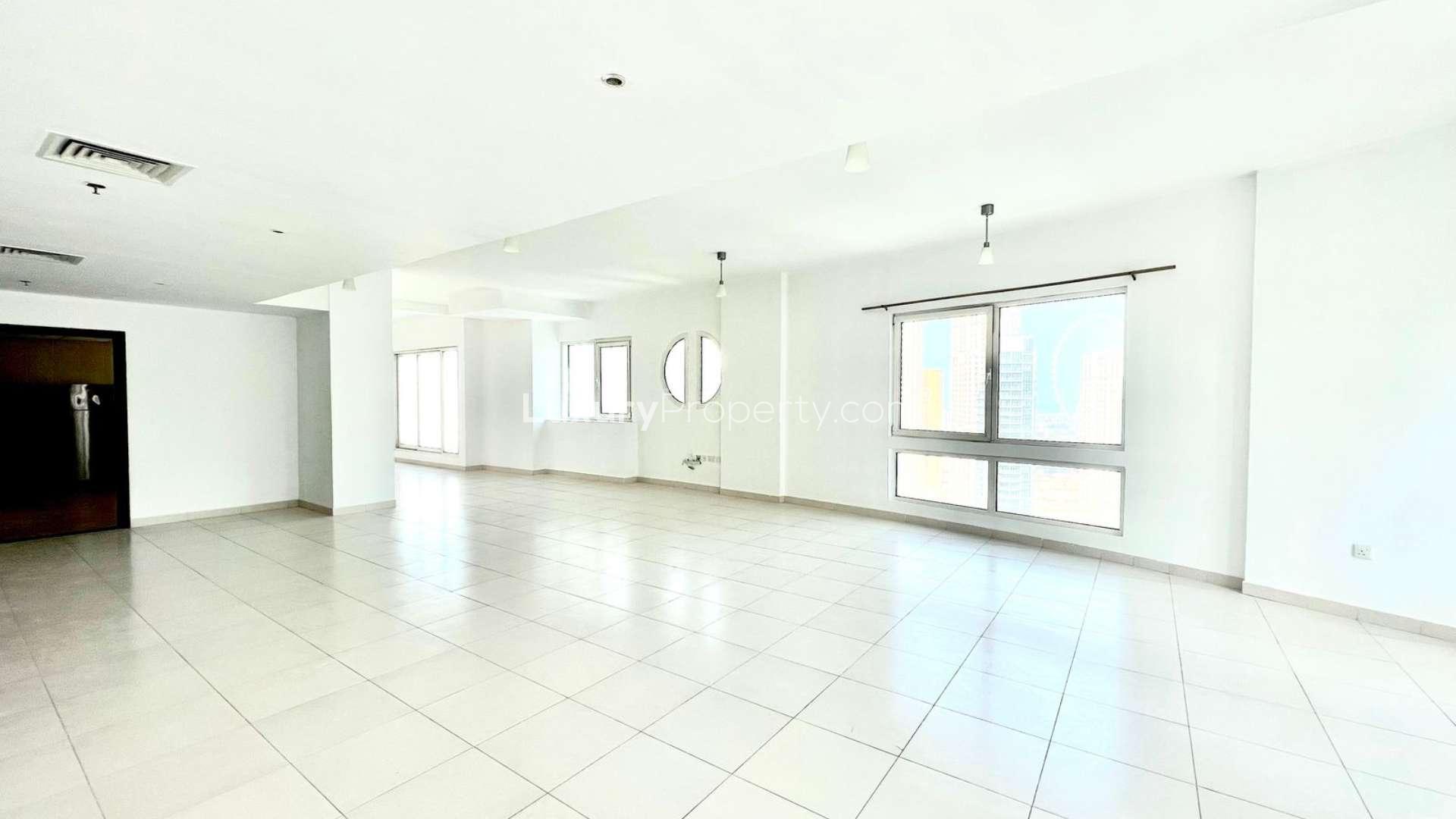 Dubai Marina view from penthouse balcony, overlooking yachts and skyscrapers. Ideal rental property