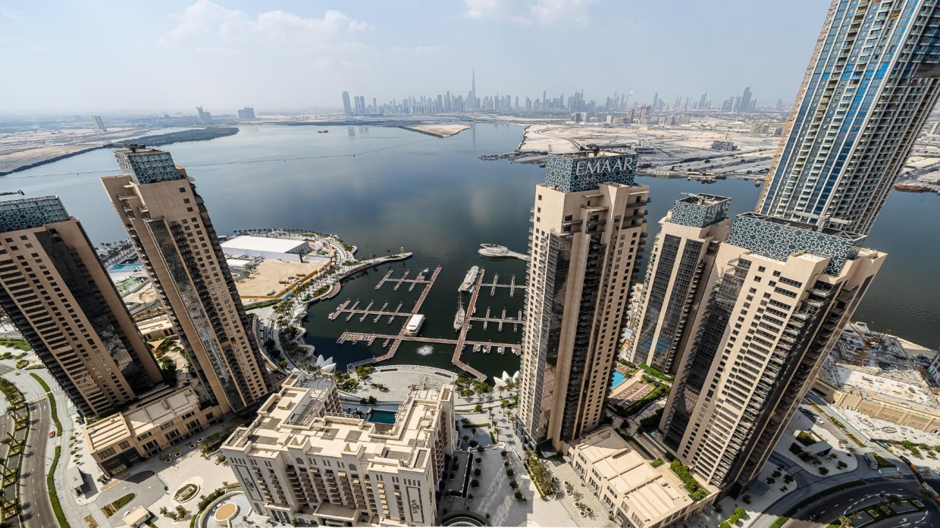 Aerial view of Dubai Creek Harbour penthouse with marina and skyline in background