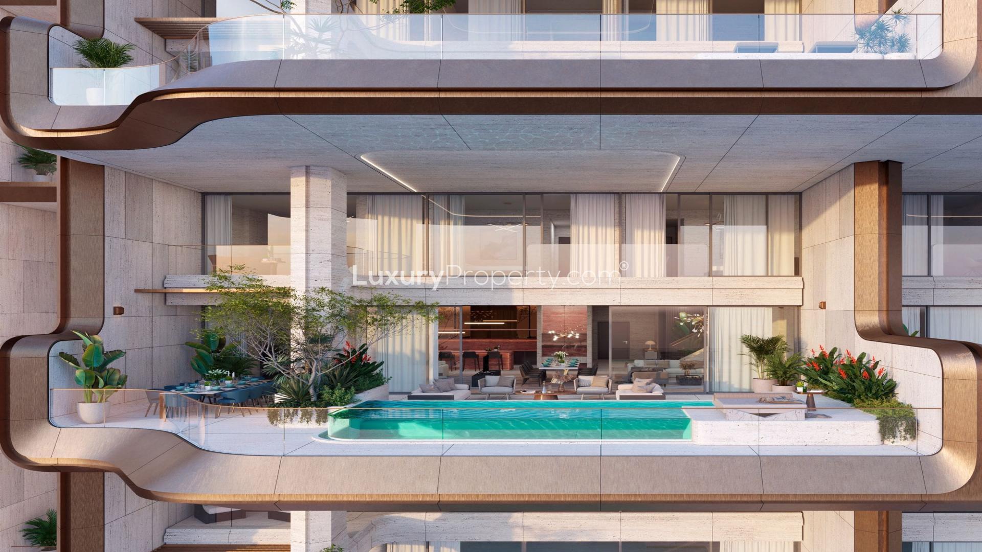 Exterior view of luxurious ELA Residences penthouse in Palm Jumeirah, surrounded by lush greenery