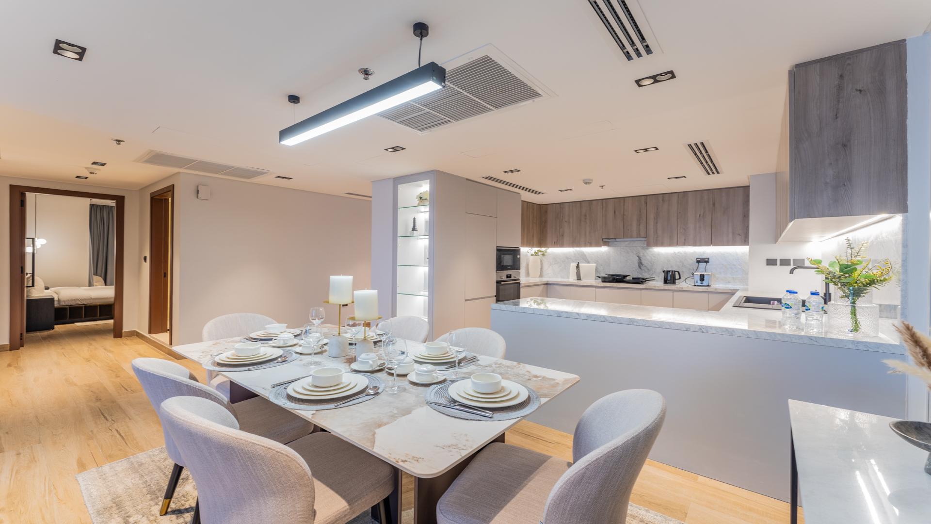 Modern living room in luxury penthouse, Palm Jumeirah, featuring elegant decor and spacious layout