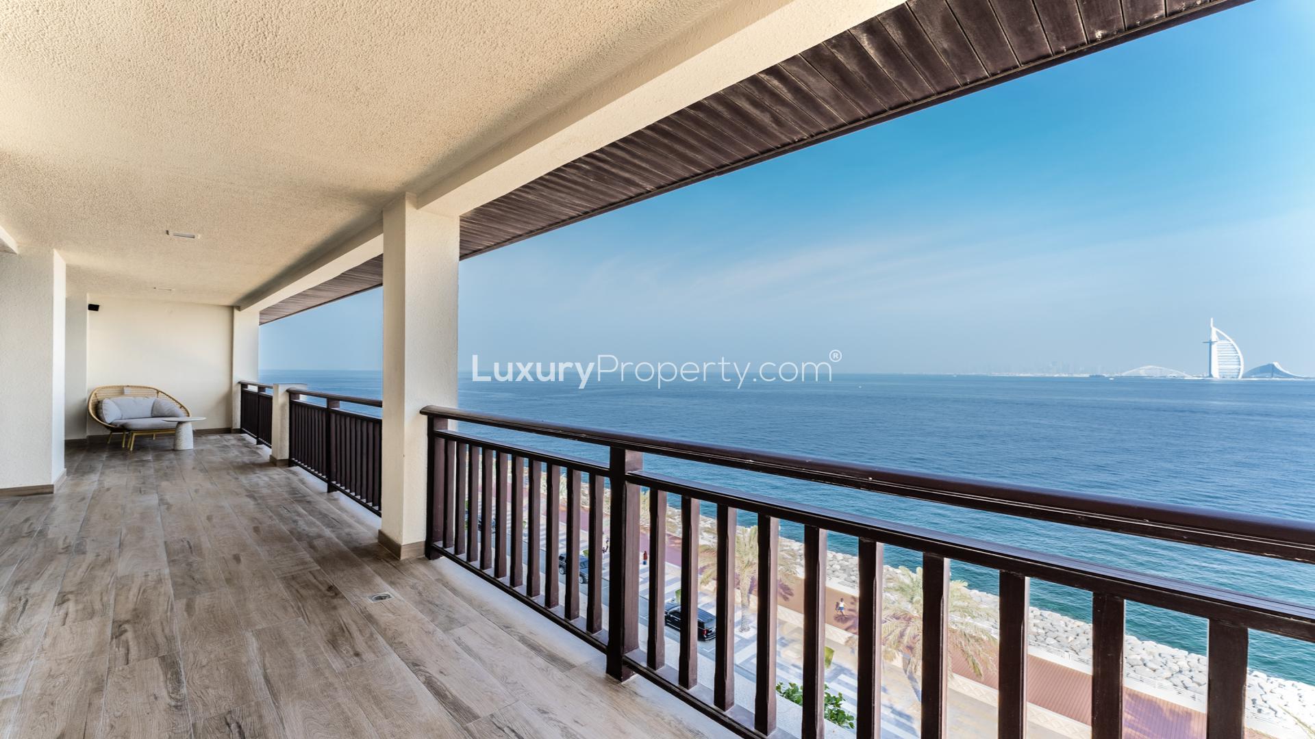 Dining area and modern kitchen in Palm Jumeirah penthouse, The Royal Amwaj