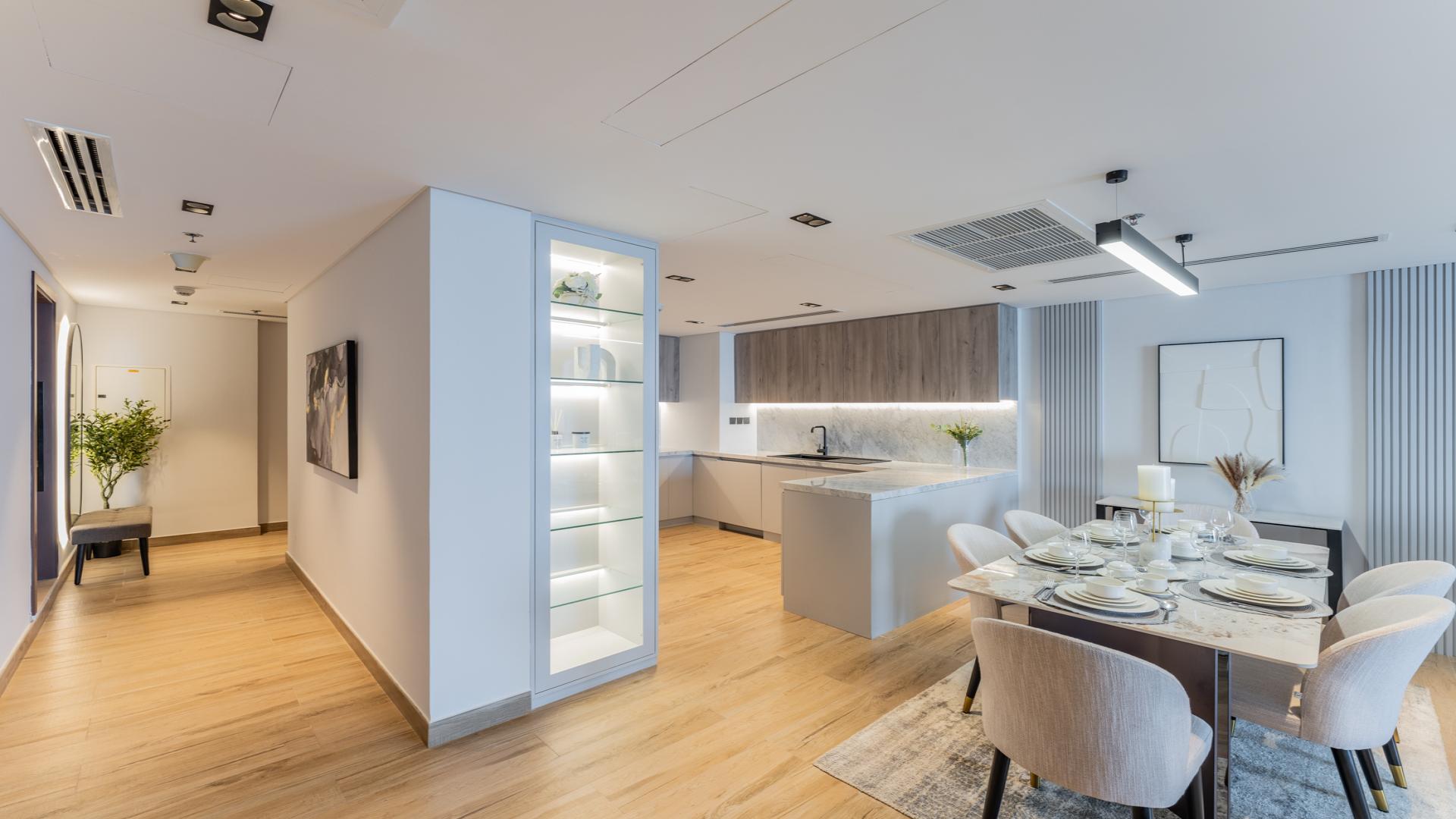 Modern dining and kitchen area in luxury Palm Jumeirah penthouse, The Royal Amwaj