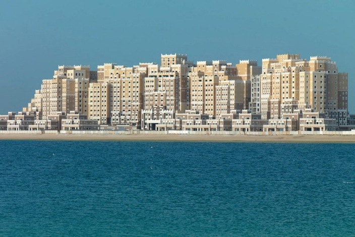 Modern kitchen in 3-bedroom penthouse, Palm Jumeirah, featuring sleek cabinets and mosaic backsplash