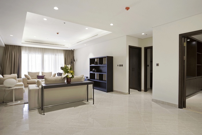 Modern living room in Palm Jumeirah penthouse, featuring elegant decor and natural light