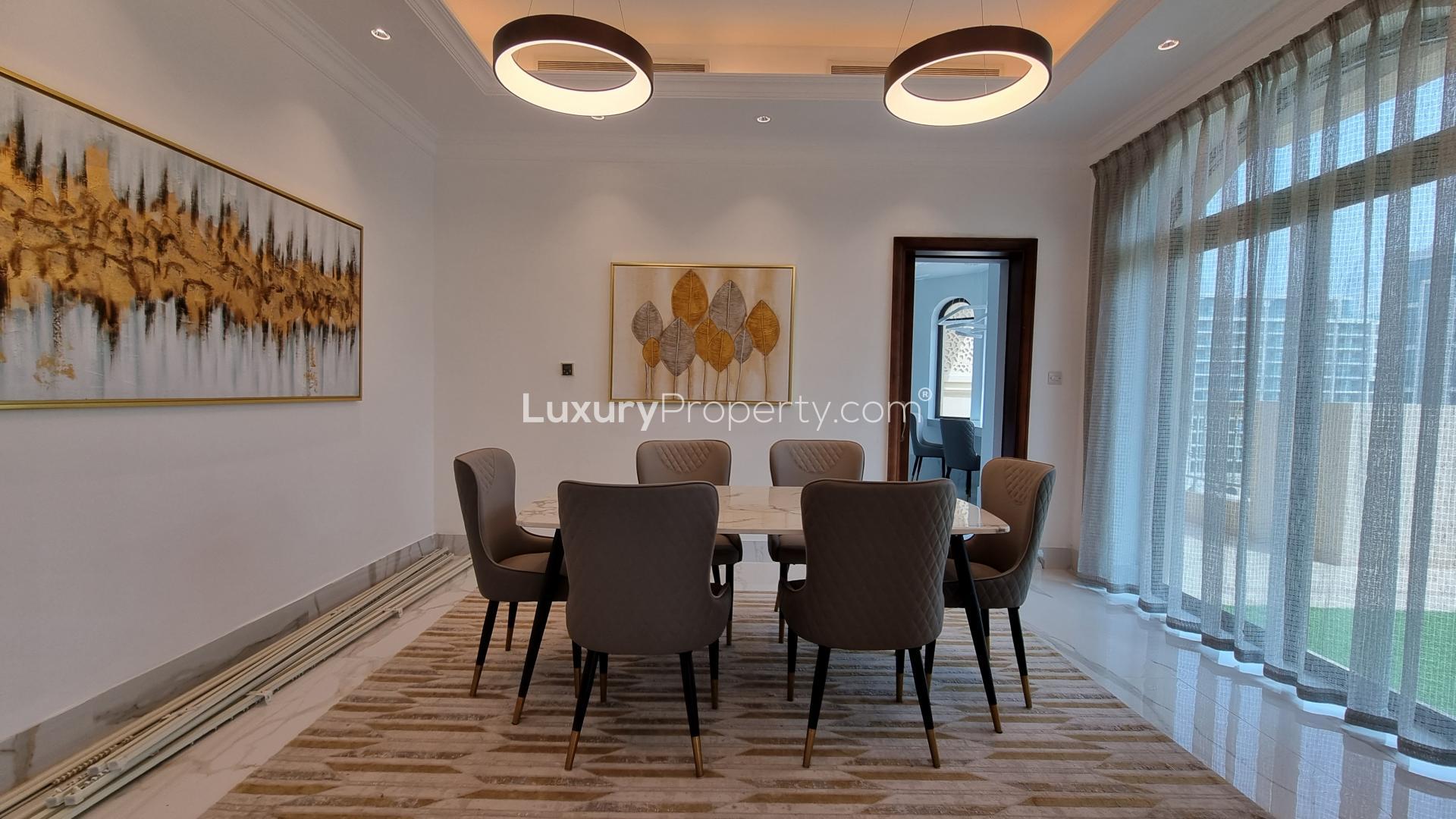 Dining area in spacious 3-bedroom penthouse, Golden Mile, Palm Jumeirah, with modern decor