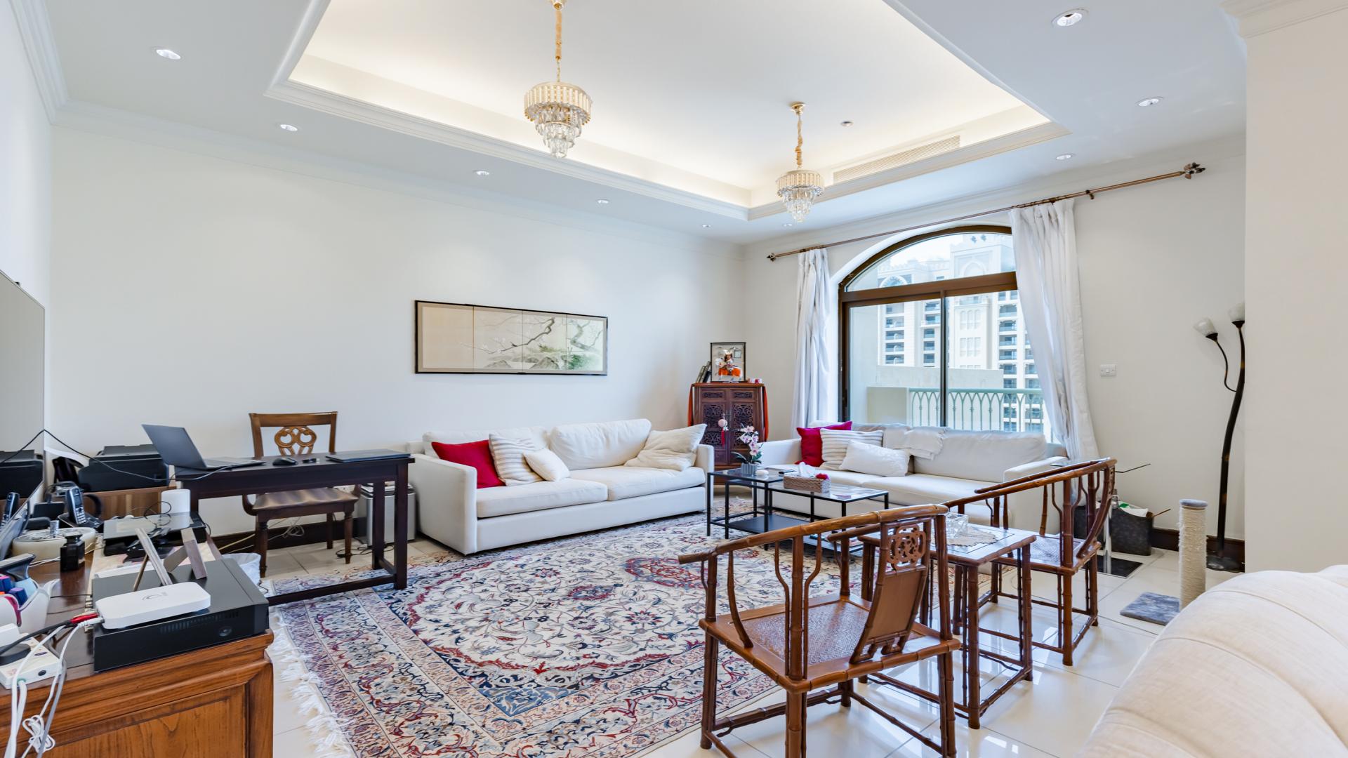 Luxurious living room in a Palm Jumeirah penthouse with elegant decor and modern furnishings