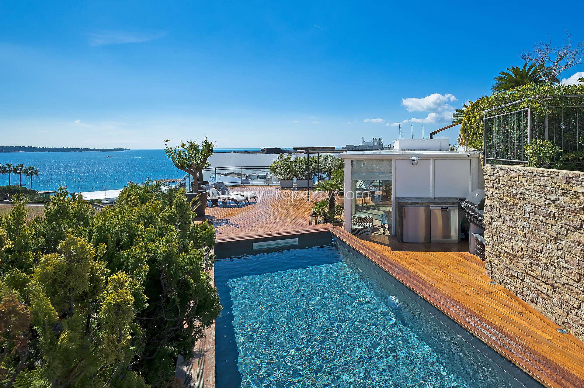 Luxurious living room in Cannes penthouse, French Riviera, with modern decor and natural light