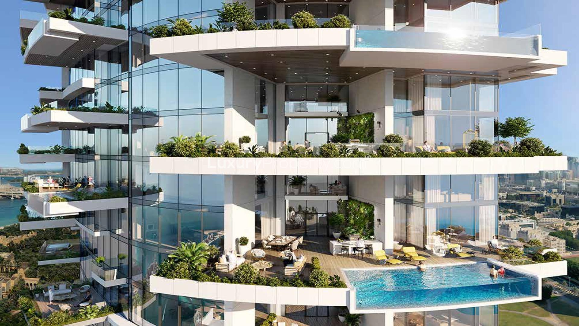 Outdoor pool area at Cavalli Tower, Dubai Marina penthouse for sale, lush greenery and loungers