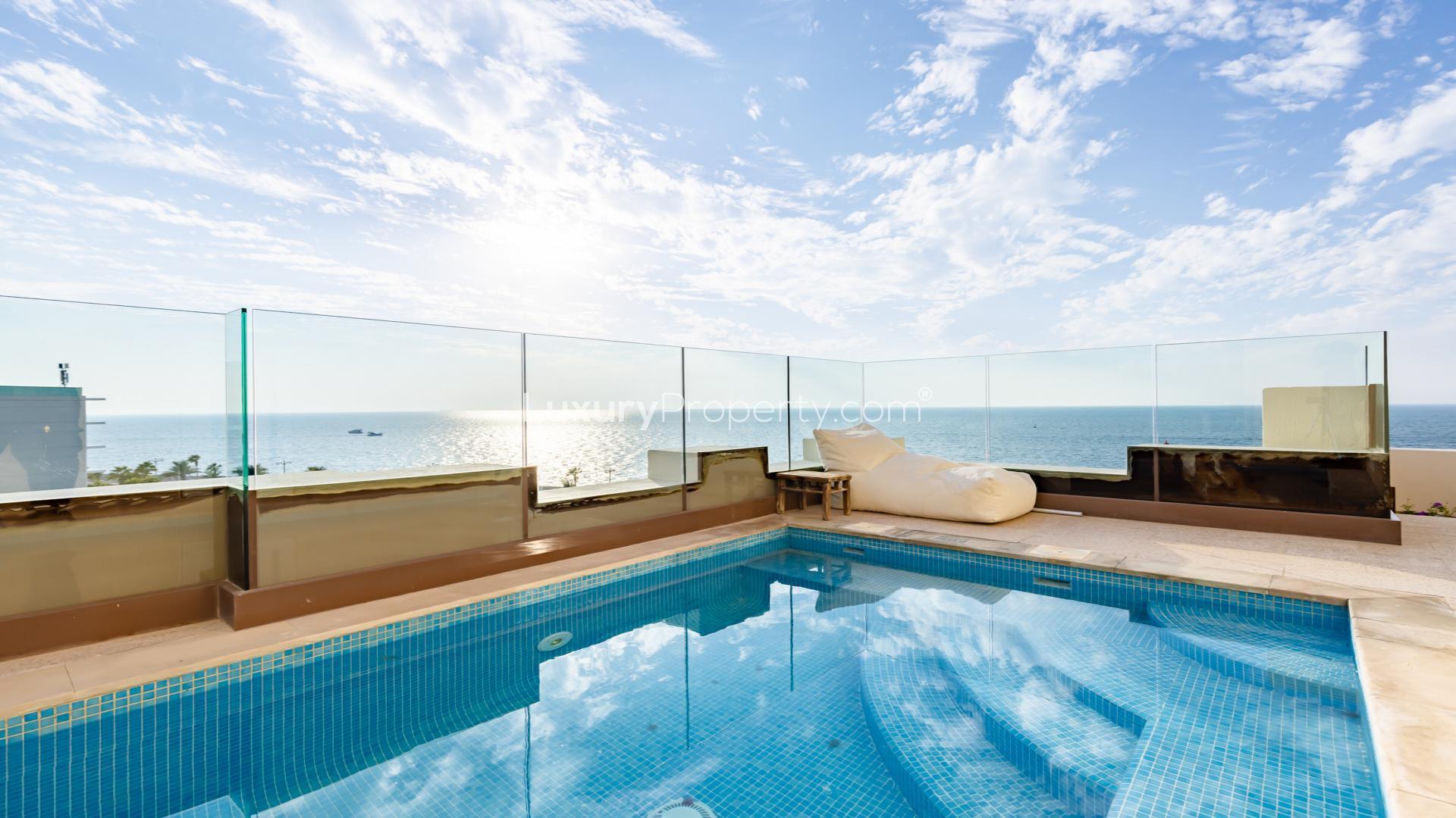 Luxurious living room in Palm Jumeirah penthouse, modern furniture, elegant decor, sea views