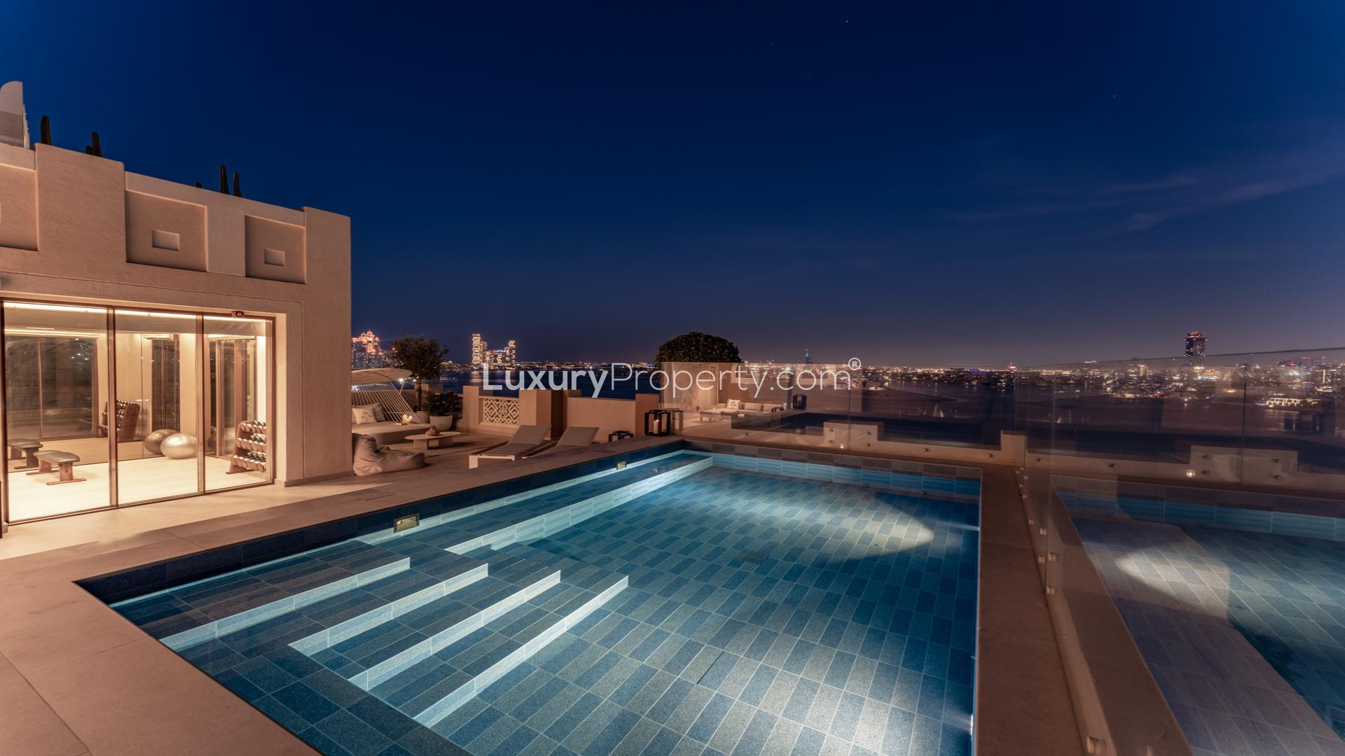 Luxurious open-plan living area in sleek duplex penthouse, Palm Jumeirah, with modern decor