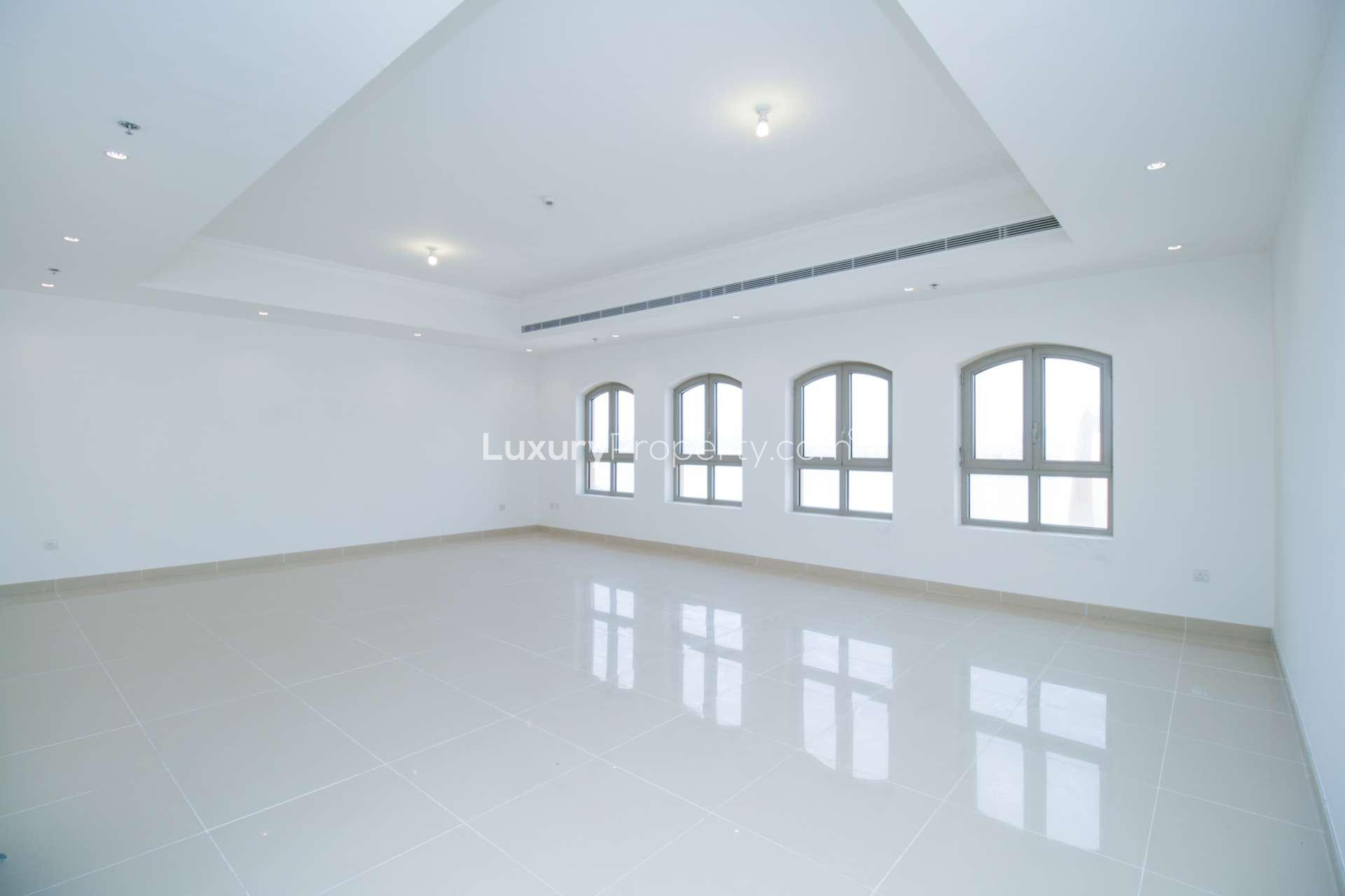 Empty bedroom with built-in wooden wardrobe in Sarai Apartments, Palm Jumeirah penthouse