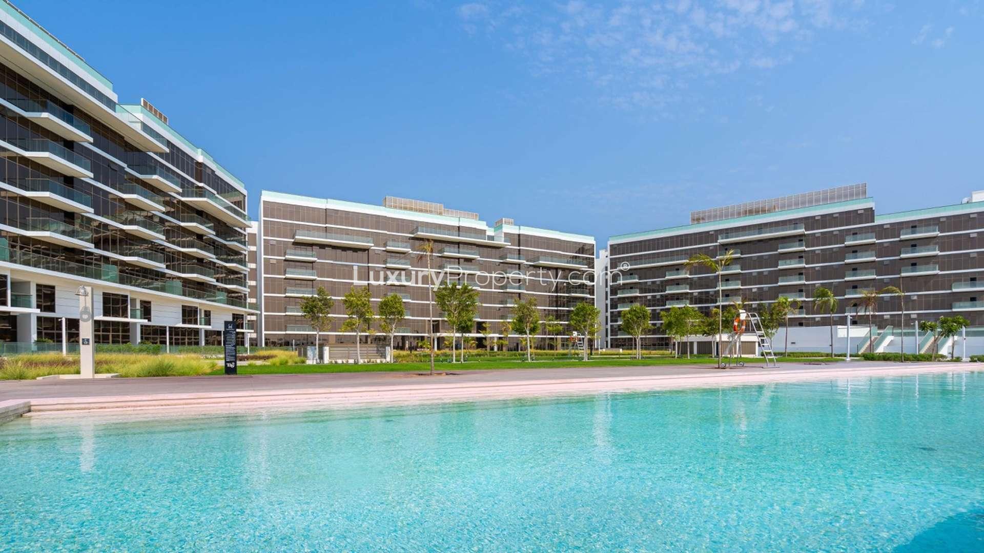 "Luxurious penthouse at The 8 Residence, Palm Jumeirah with pool view for sale.",Modern penthouse exterior at The 8 Residence, Palm Jumeirah, featuring lush green lawn