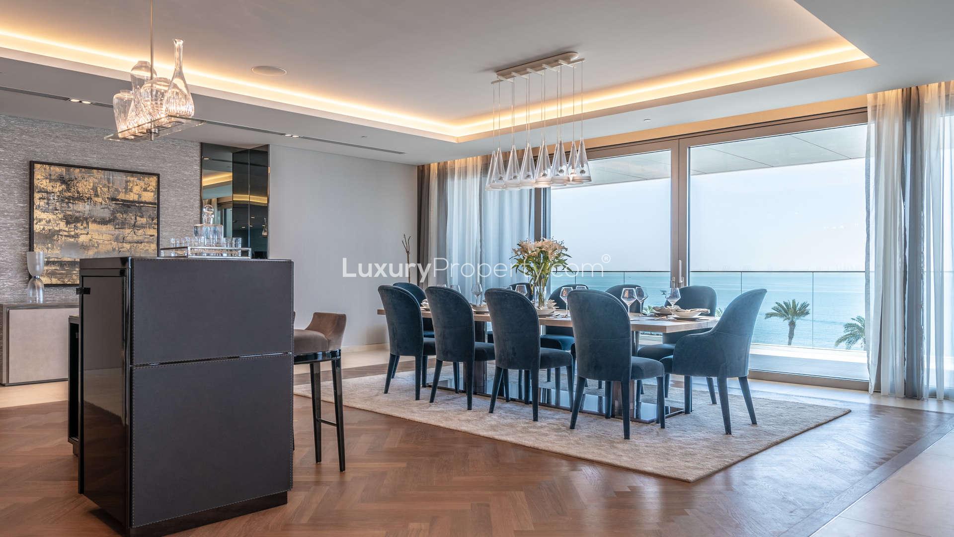 Modern kitchen in 3-bed penthouse, W Residences, Palm Jumeirah, featuring sleek cabinetry and bar stools