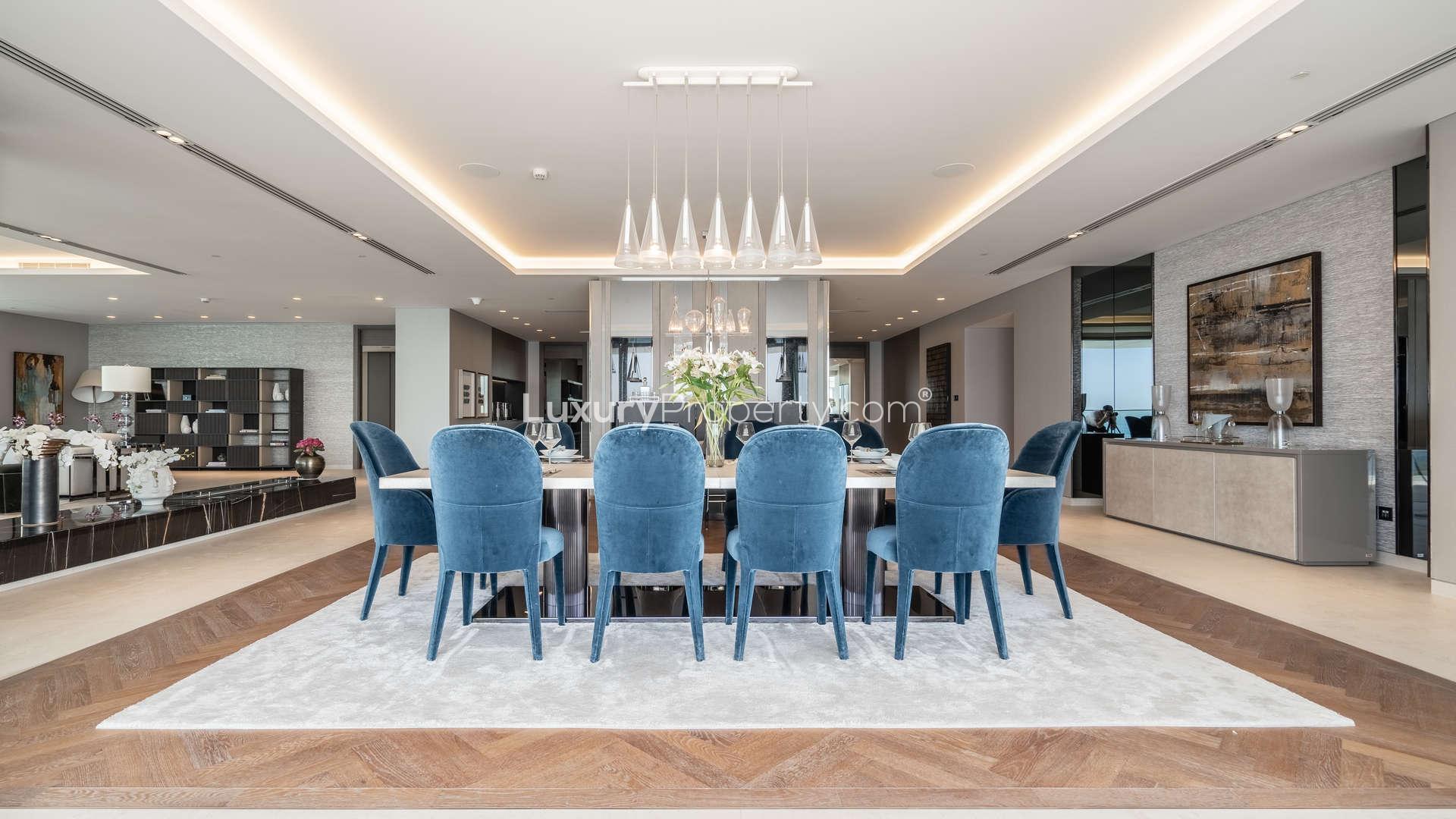 Luxurious dining area in 3-bed penthouse, W Residences, Palm Jumeirah, elegant blue chairs