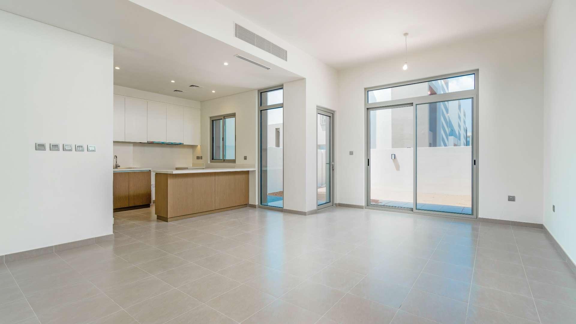 Modern townhouse exterior in Reem Community, Arabian Ranches 2 with patio and glass balcony