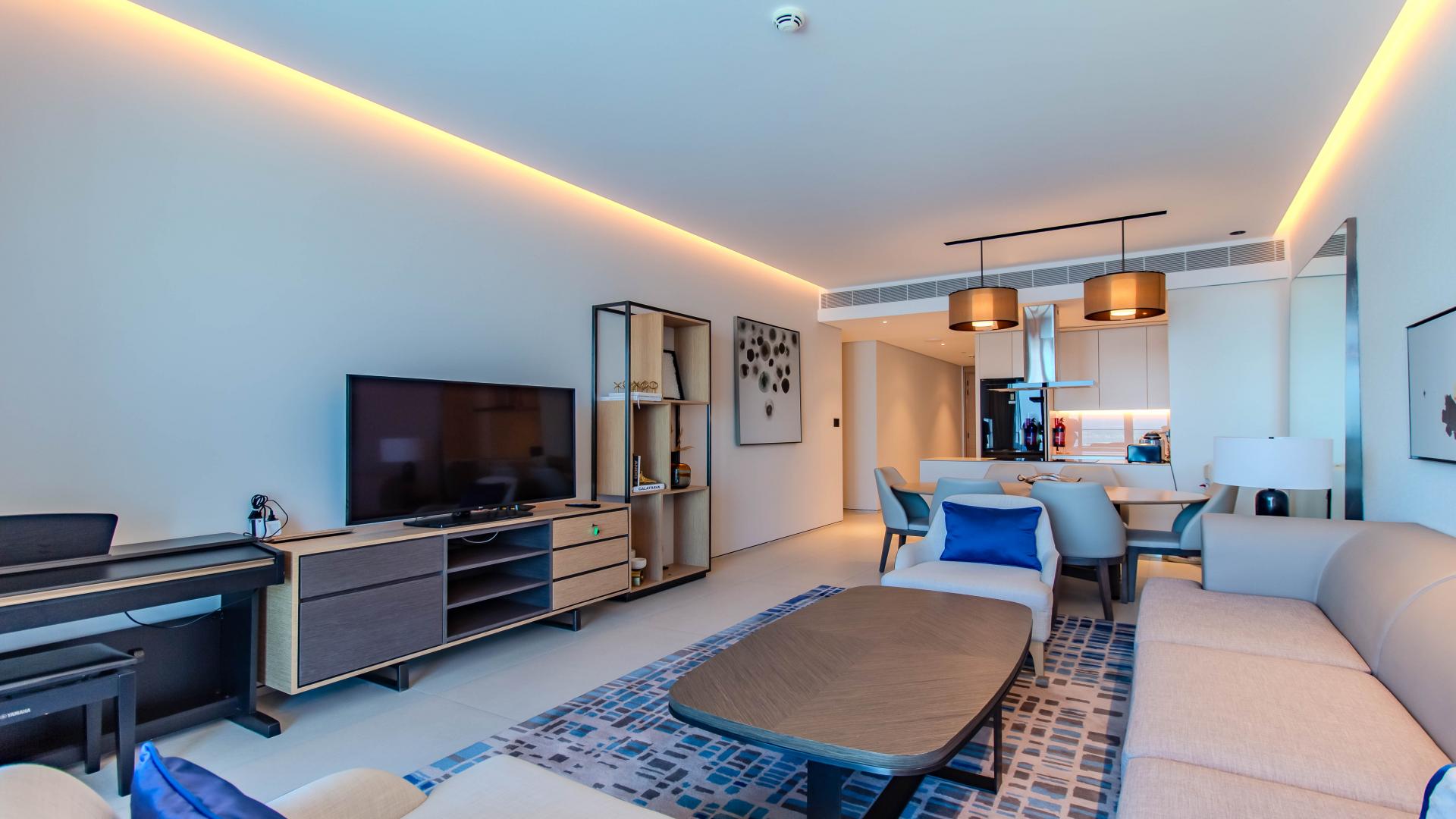 Fully furnished living room in Jumeirah Beach Residence apartment with sea view balcony