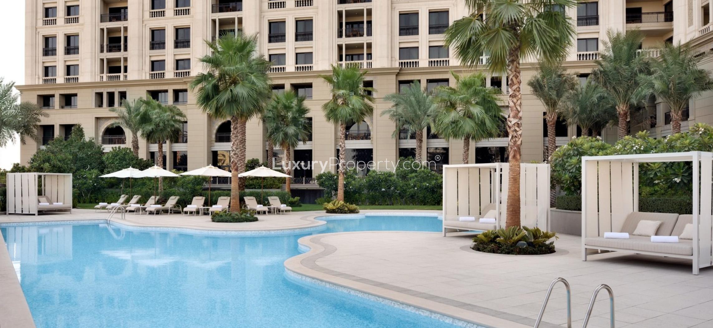 Luxurious Palazzo Versace apartment exterior reflecting on water at night, Culture Village