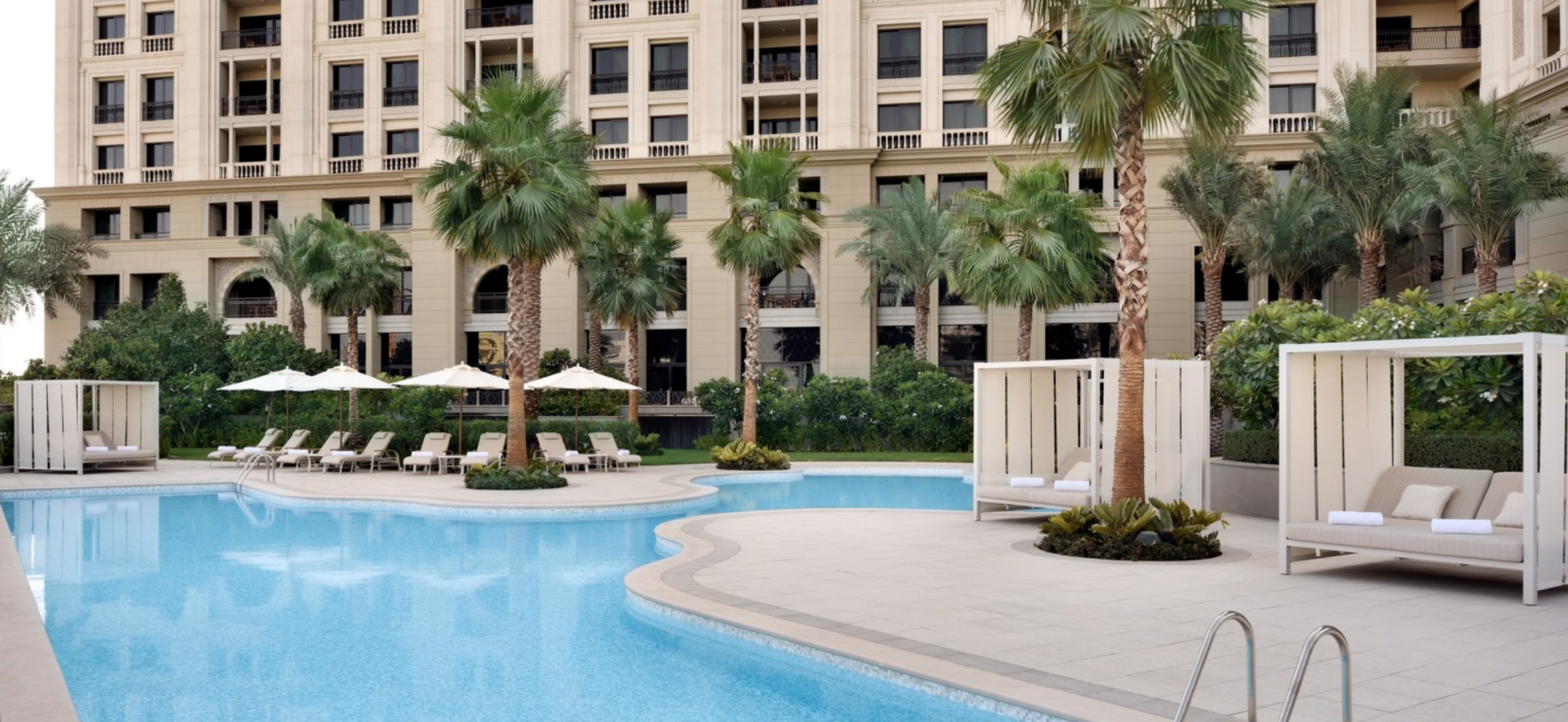 Luxurious Palazzo Versace apartment exterior reflecting on water at night, Culture Village