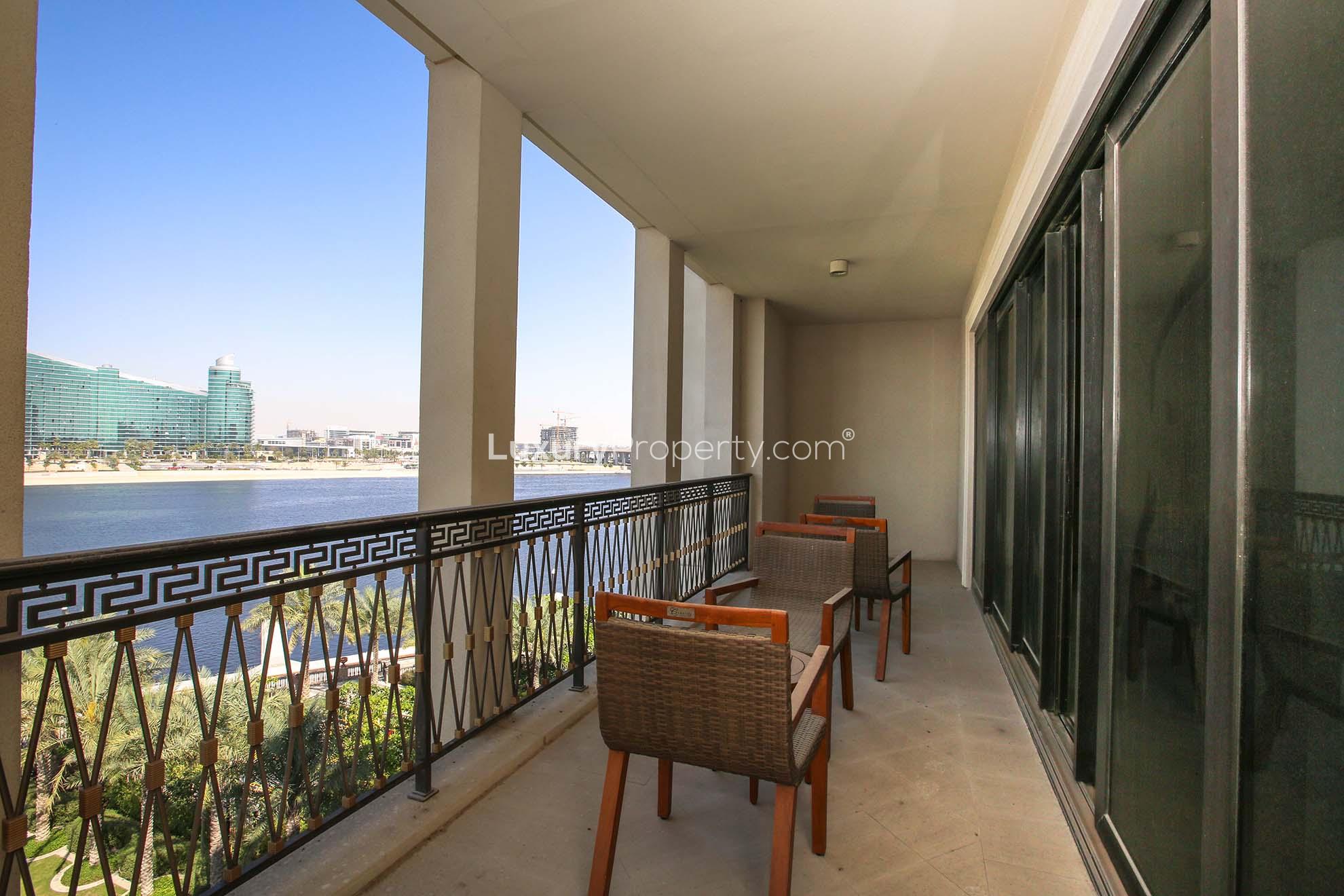 "Luxurious Palazzo Versace apartment exterior at night, Culture Village, available for sale.",Spacious balcony with river views in Palazzo Versace apartment, Culture Village
