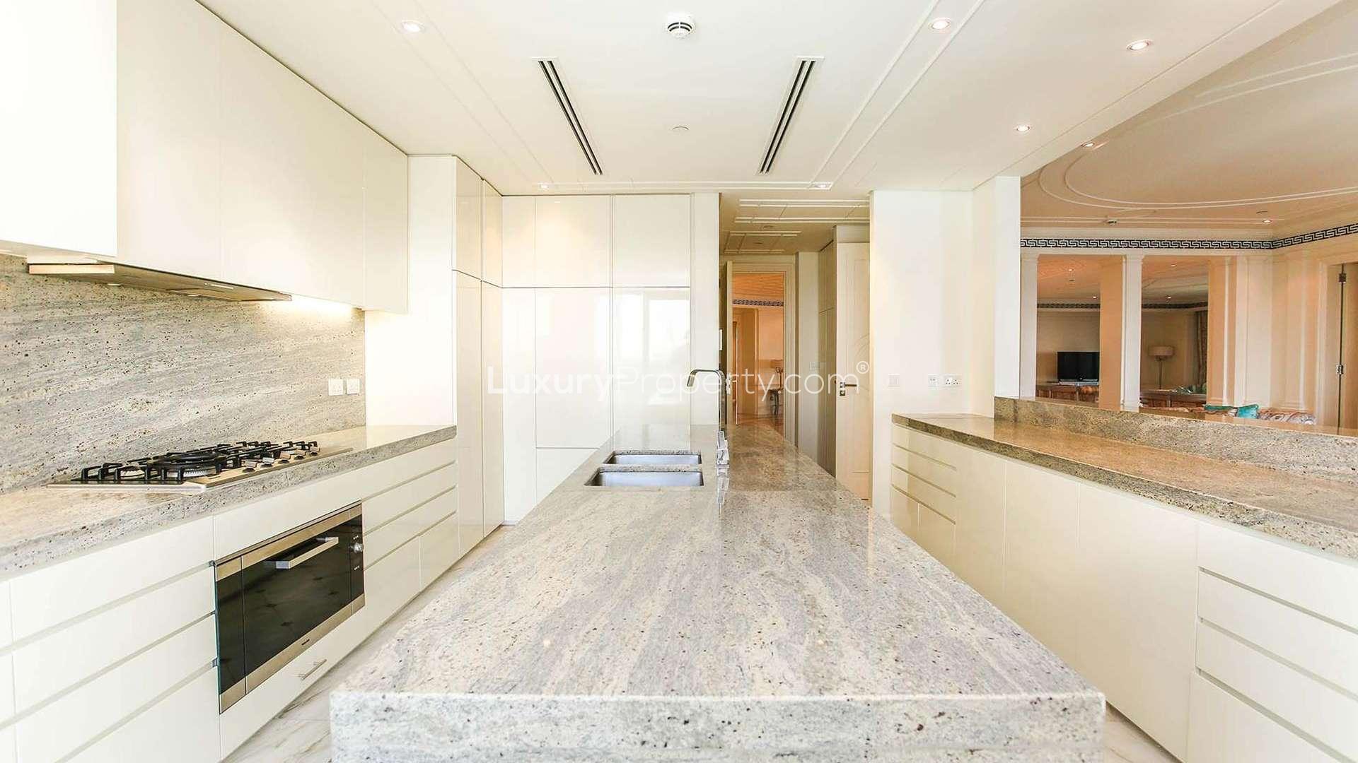 "Spacious balcony view at three-bedroom apartment, Palazzo Versace, Culture Village, Dubai for rent.",Luxury kitchen in three-bedroom apartment, Palazzo Versace, Culture Village, available for rent