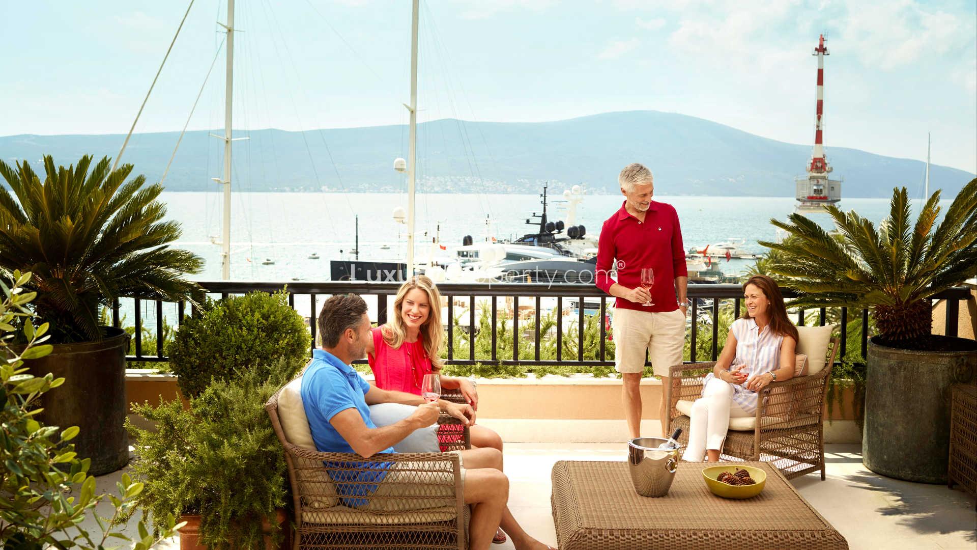 Luxurious lobby with indoor tree at Regent Pool Residence, Porto Montenegro