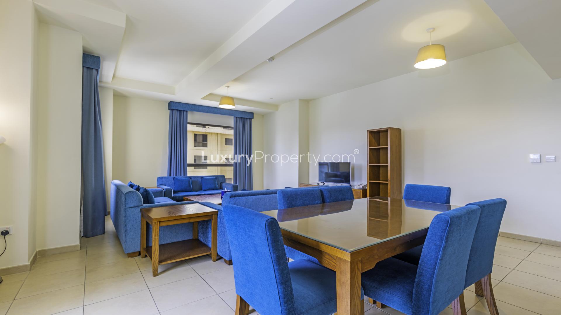 "Sea view from JBR apartment, Amwaj, 3-bedroom rental, beachfront, panoramic skyline, LP12880.",Spacious living room in fully furnished JBR apartment, blue decor, dining area, Amwaj