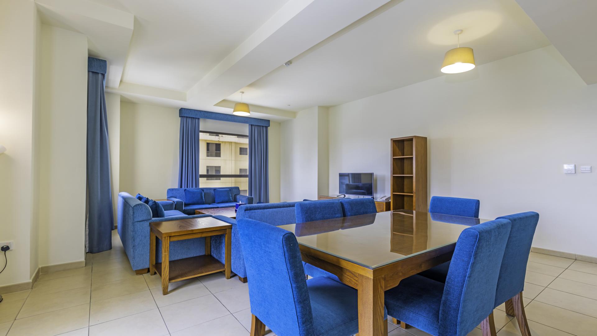 "Sea view from JBR apartment, Amwaj, 3-bedroom rental, beachfront, panoramic skyline, LP12880.",Spacious living room in fully furnished JBR apartment, blue decor, dining area, Amwaj